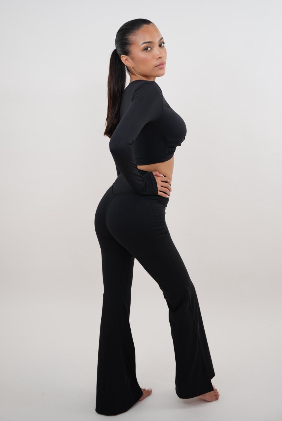 KIMITH BRAND I Am Present Black Stretch Flare Legging — detail close-up