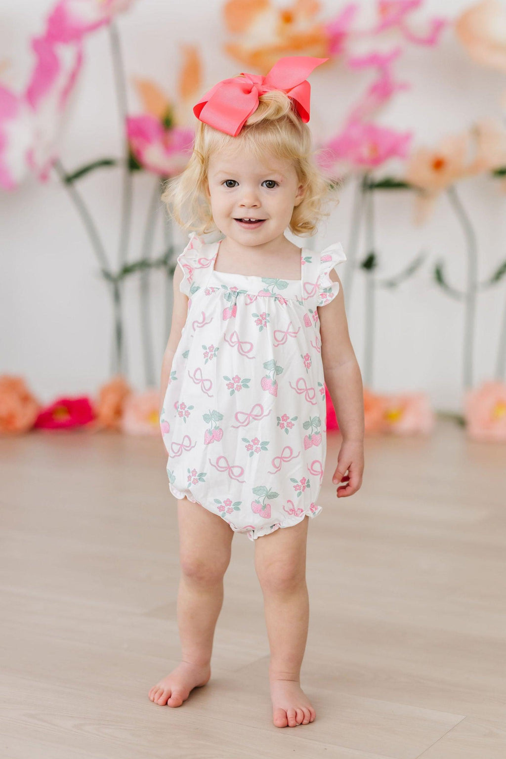 Mila & Rose ® Berries & Bows Ruffle Cross Back Romper — detail close-up