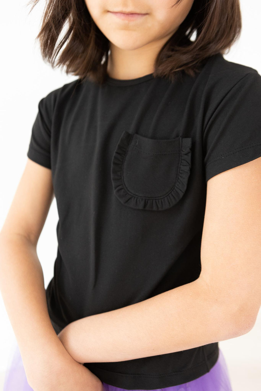 Mila & Rose ® Black Ruffle Pocket Tee — lifestyle context