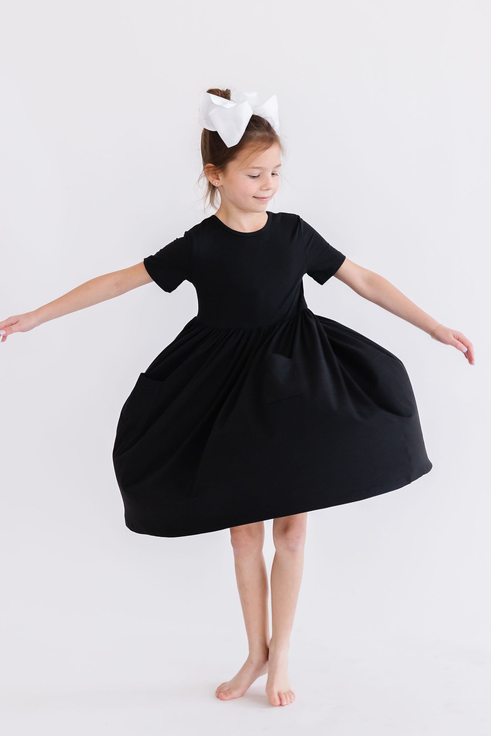 Mila & Rose ® Black S/S Pocket Twirl Dress — side view