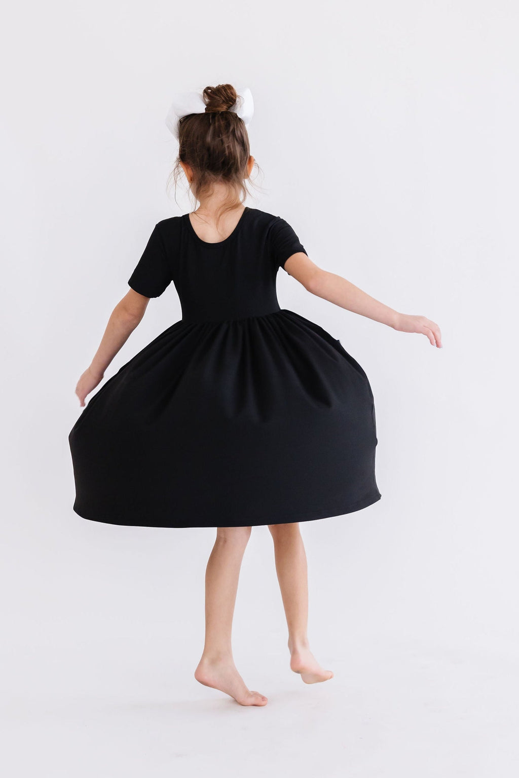 Mila & Rose ® Black S/S Pocket Twirl Dress — back view