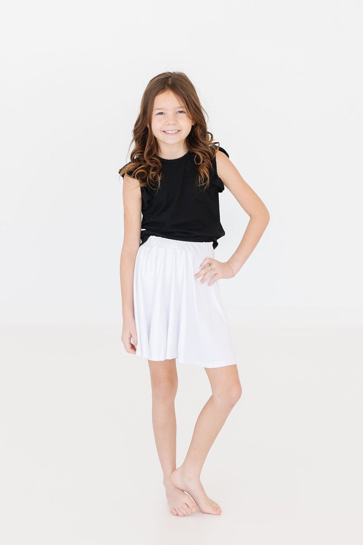 Mila & Rose ® Black S/S Ruffle Tee — lifestyle context