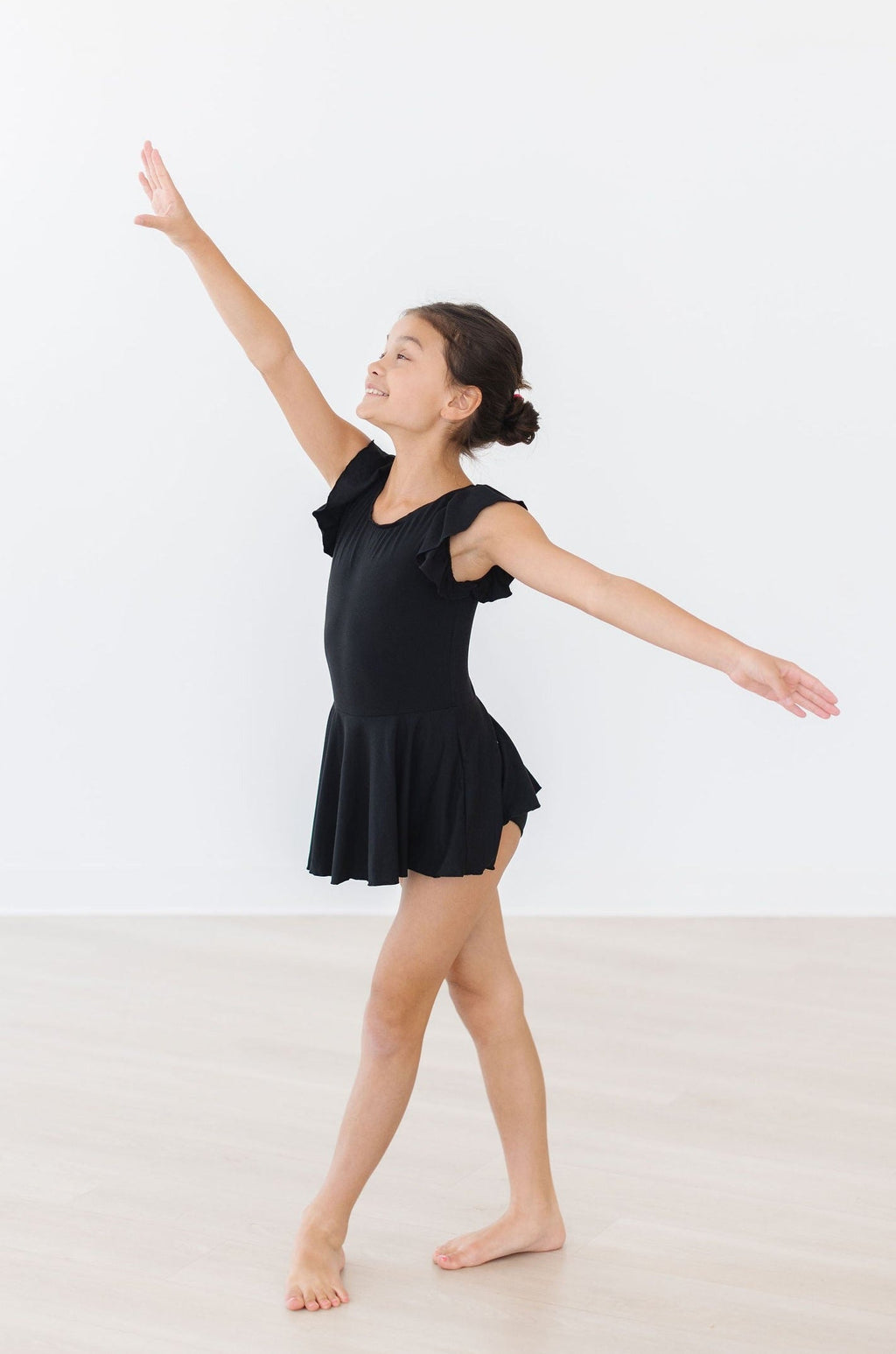 Mila & Rose ® Black S/S Twirl Leotard — lifestyle context