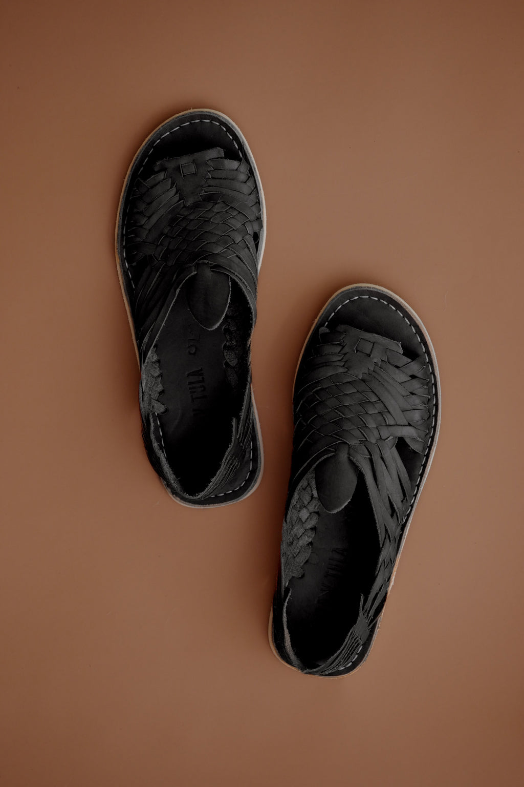 LOLA Y TULA Black Leather Pachuco Huarache — lifestyle context