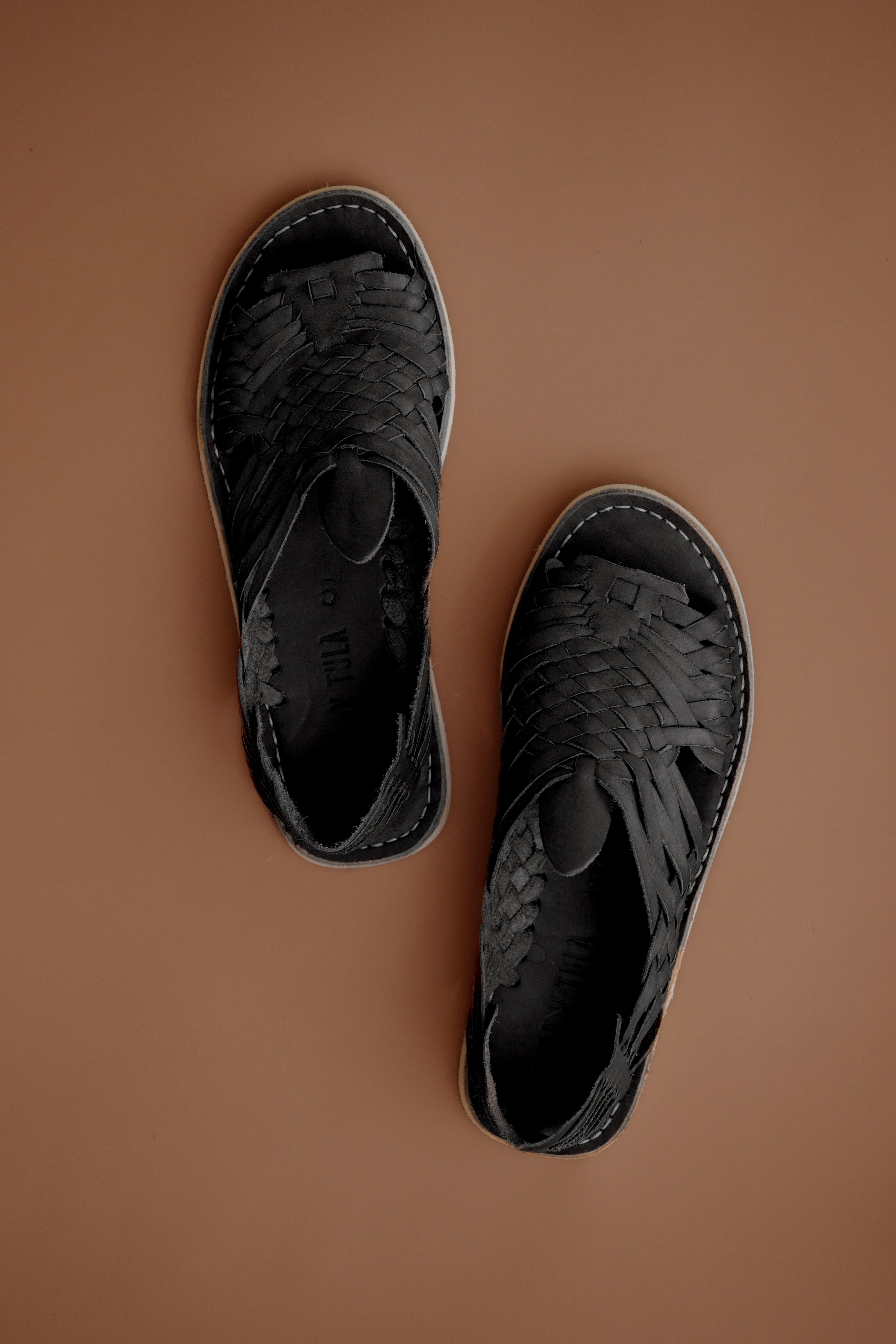 LOLA Y TULA Black Leather Pachuco Huarache — lifestyle context