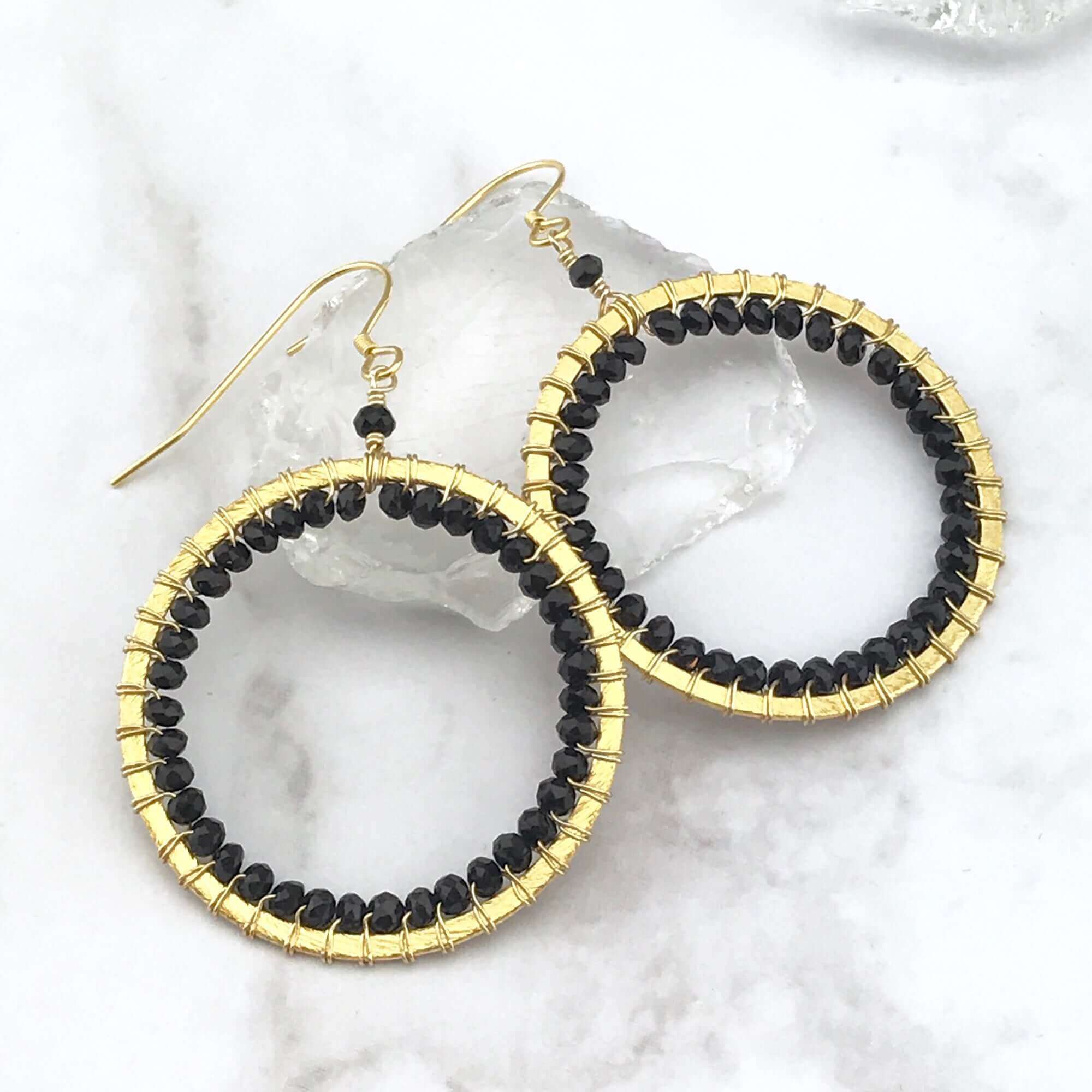 PARKEN JEWELRY Black Spinel Halo Earrings — lifestyle context