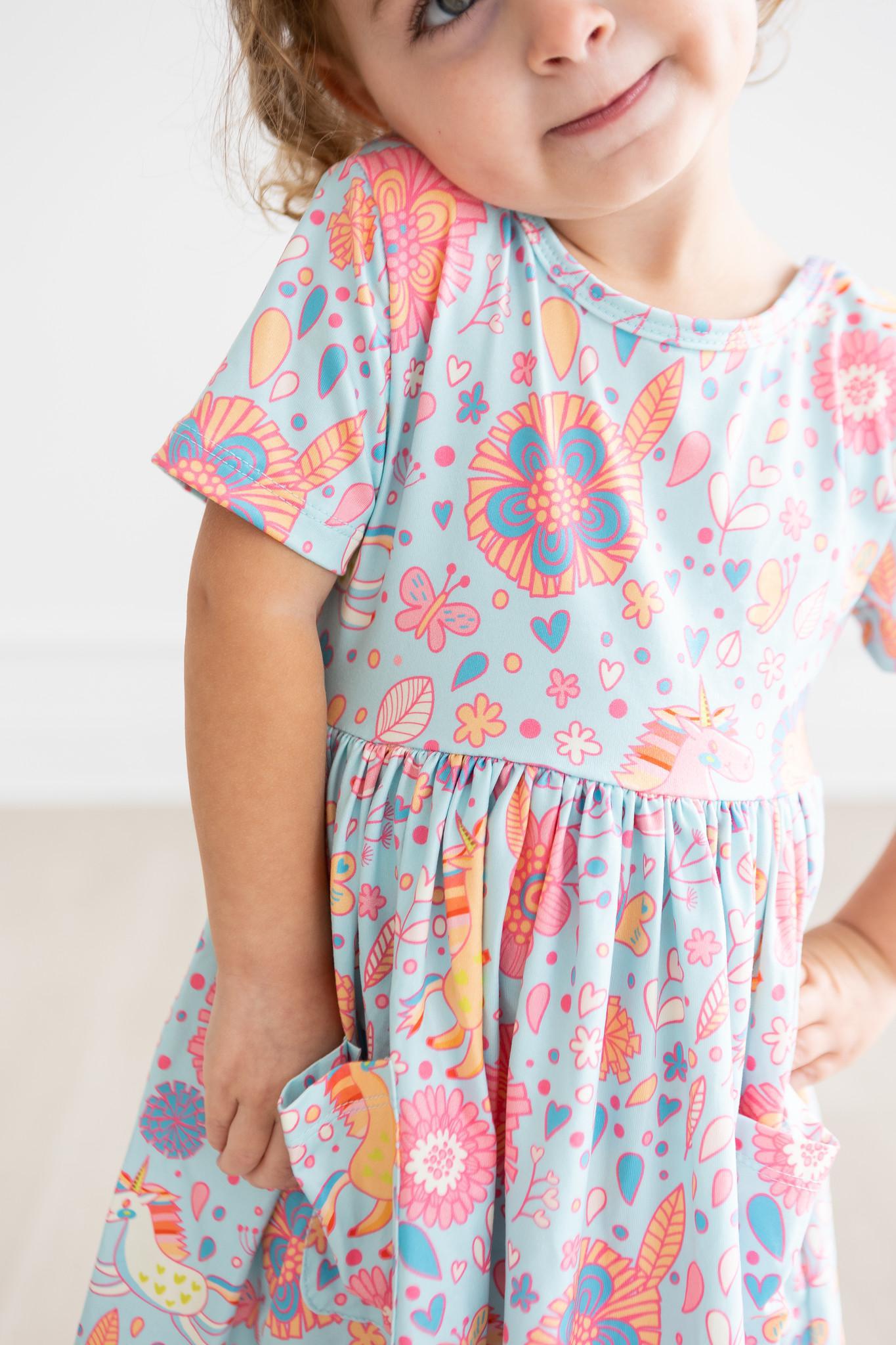 Mila & Rose ® SALE Blue Retro Unicorns S/S Pocket Twirl Dress — in-use photo