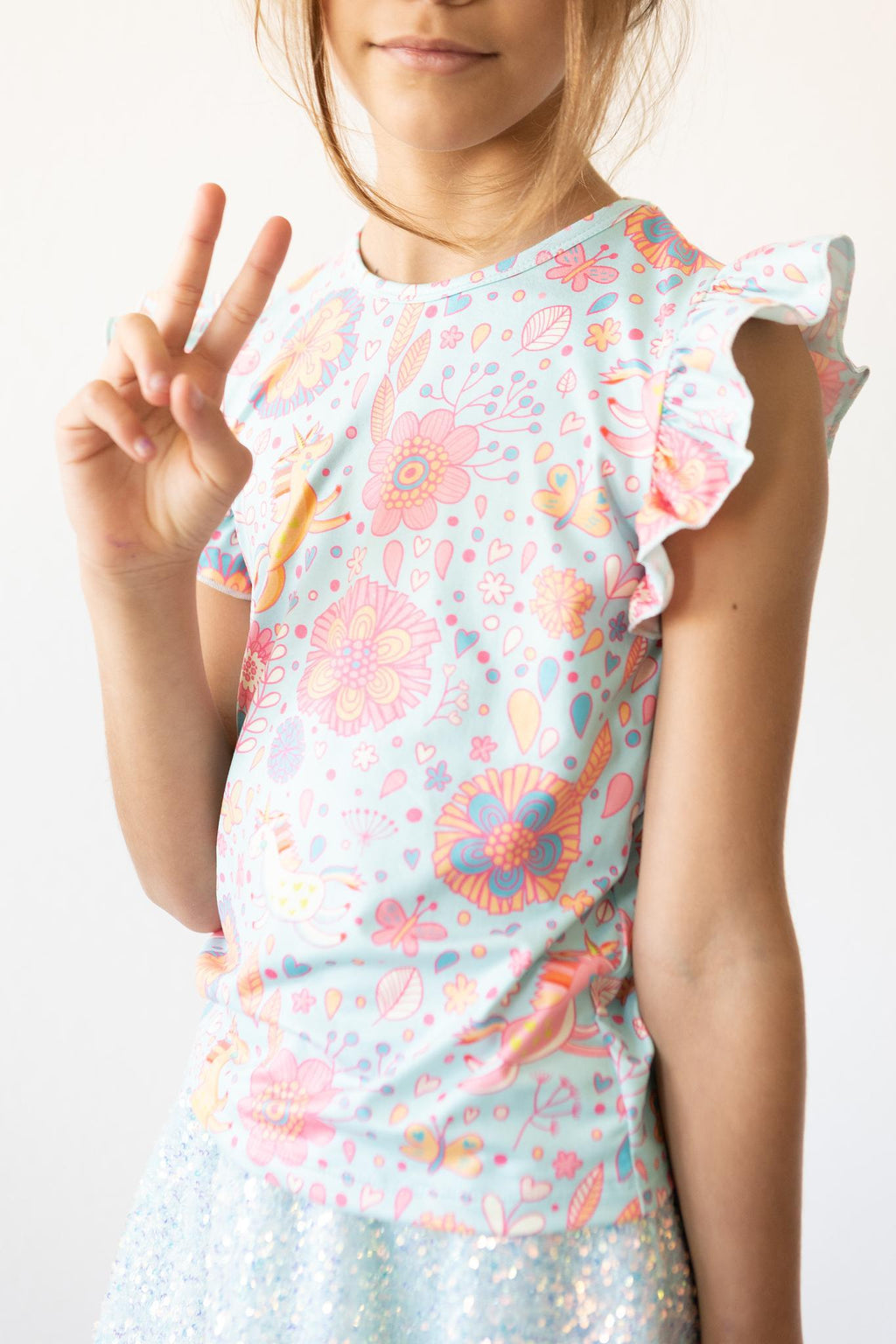 Mila & Rose ® SALE Blue Retro Unicorns S/S Ruffle Tee — alternative angle