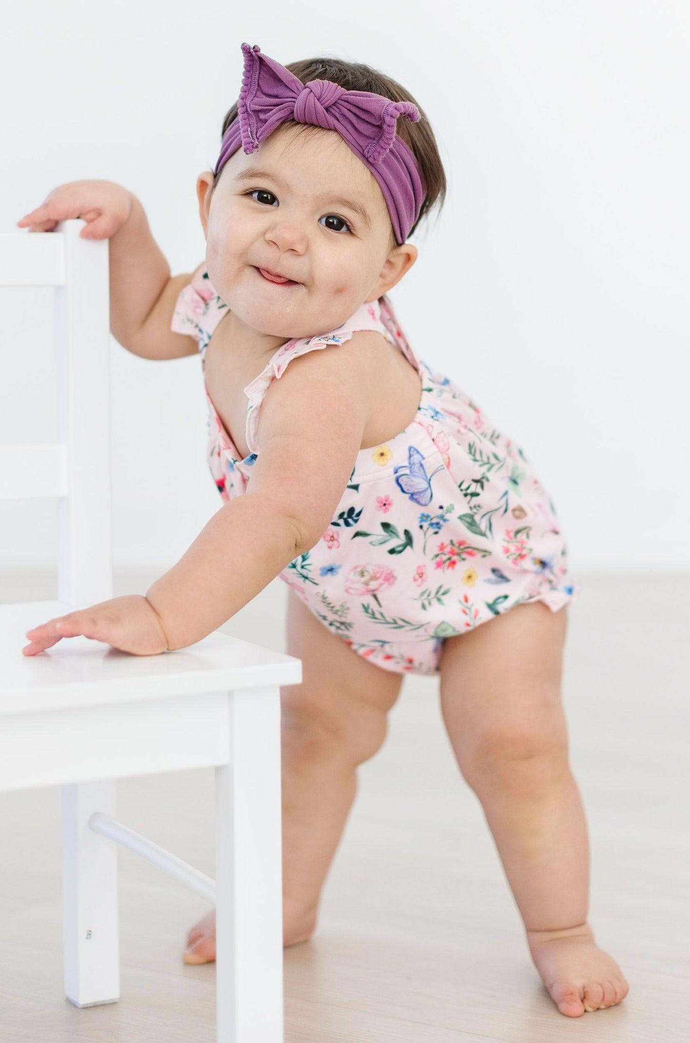 Mila & Rose ® Butterfly Meadows Ruffle Cross Back Romper — lifestyle context
