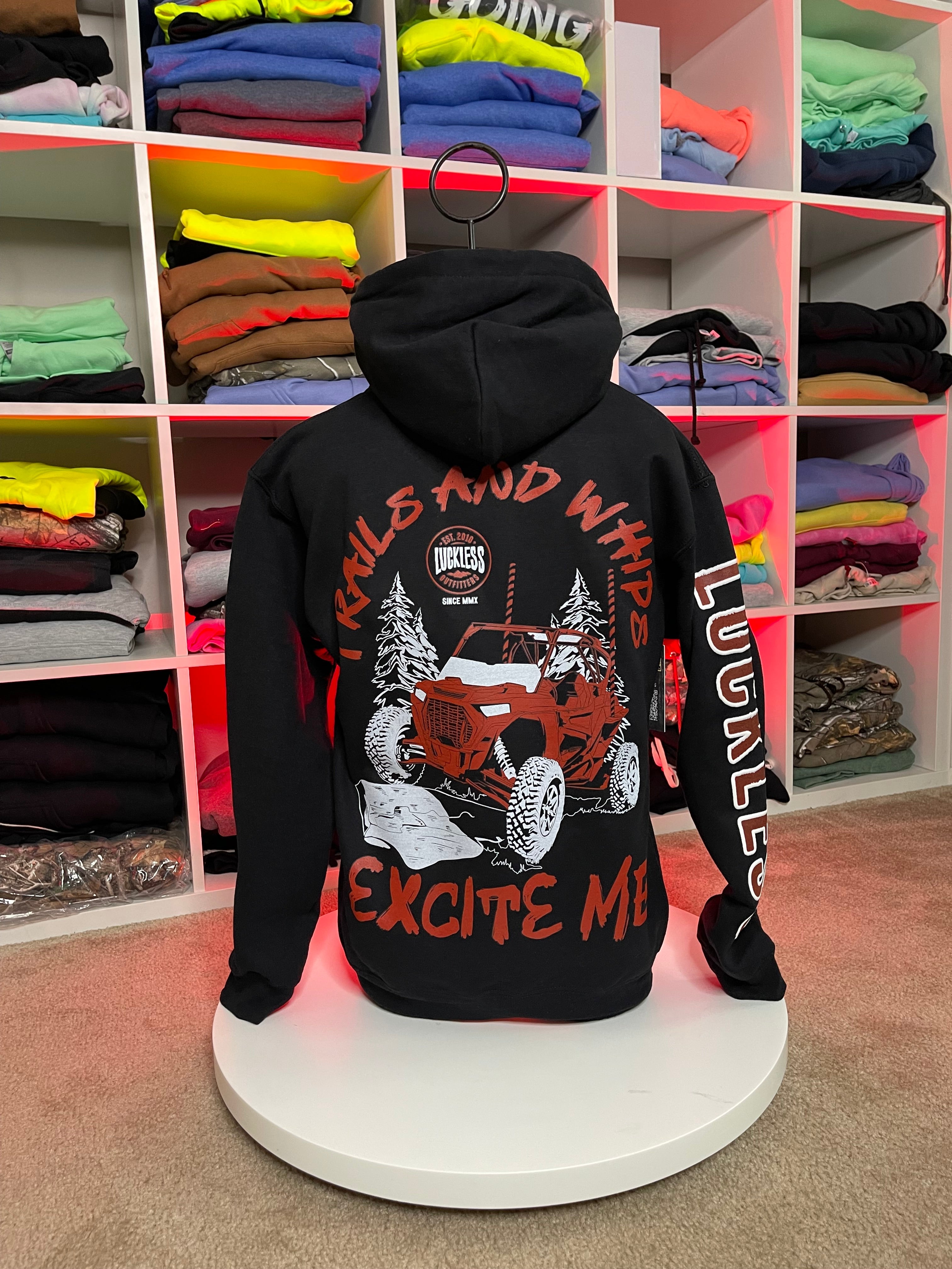 Luckless Outfitters Trails & Whips Excite Me — back view