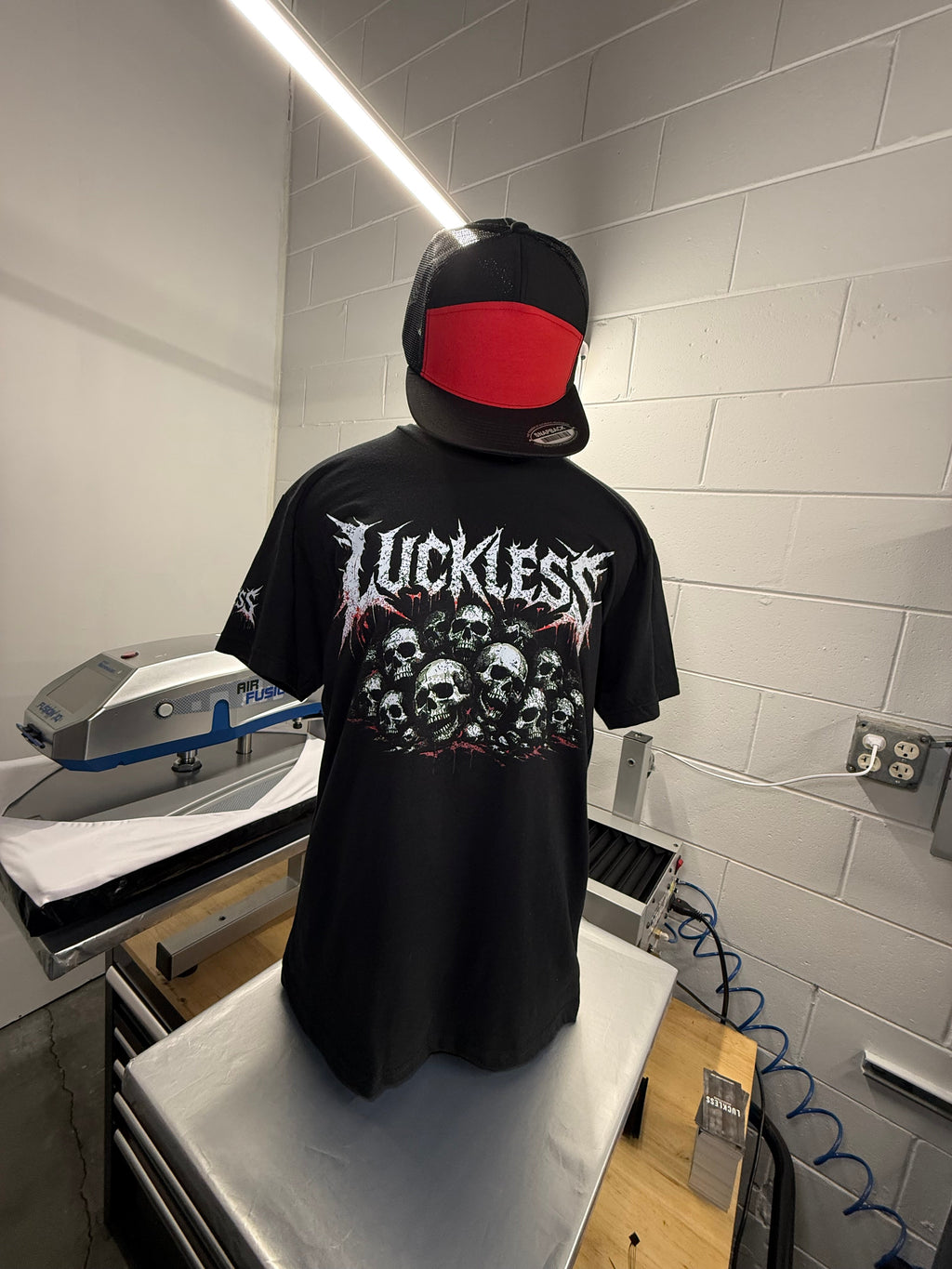 Luckless Outfitters Pile of Skulls Tee — back view