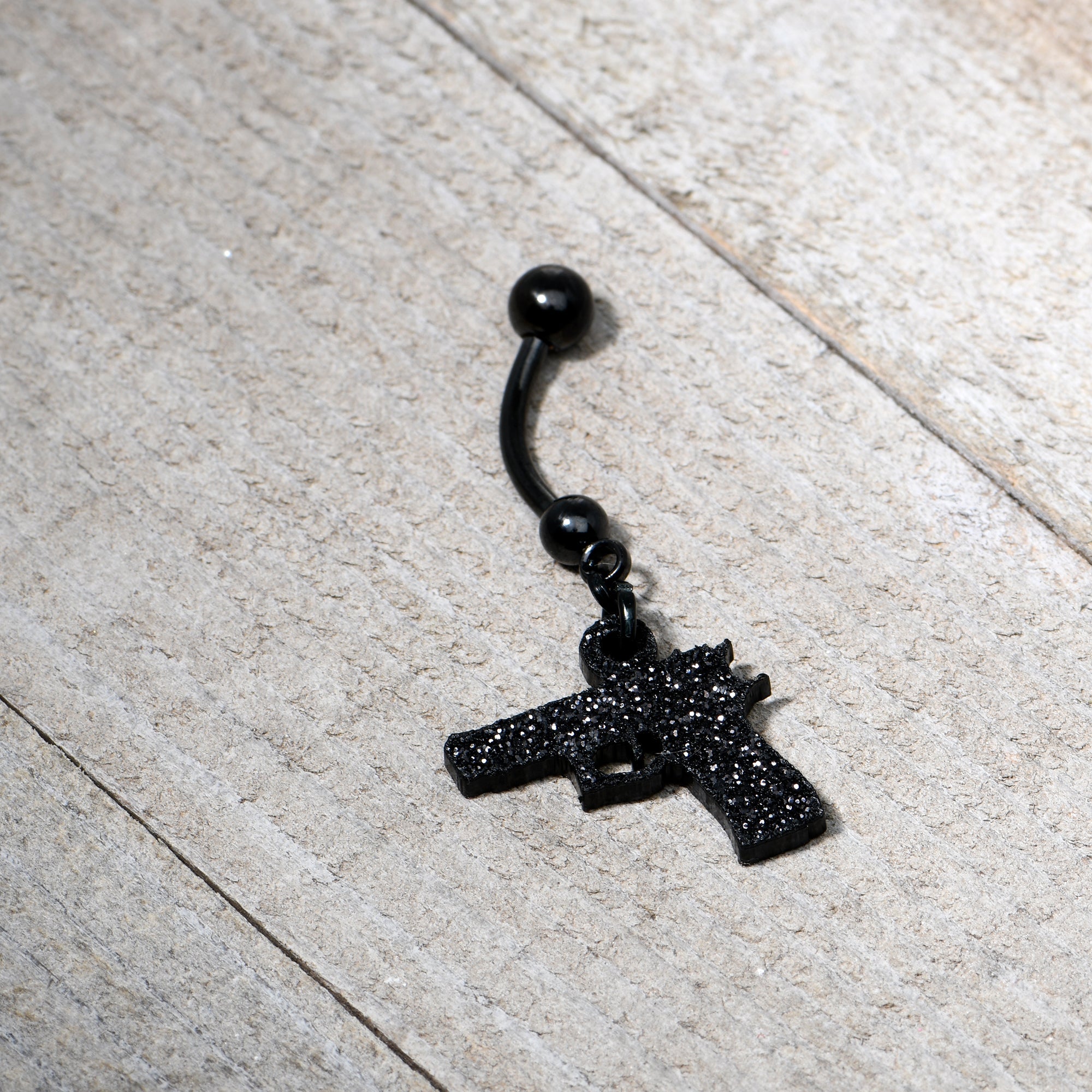 BodyCandy Jet Black Glitter Gun Dangle Belly Ring — comparison shot