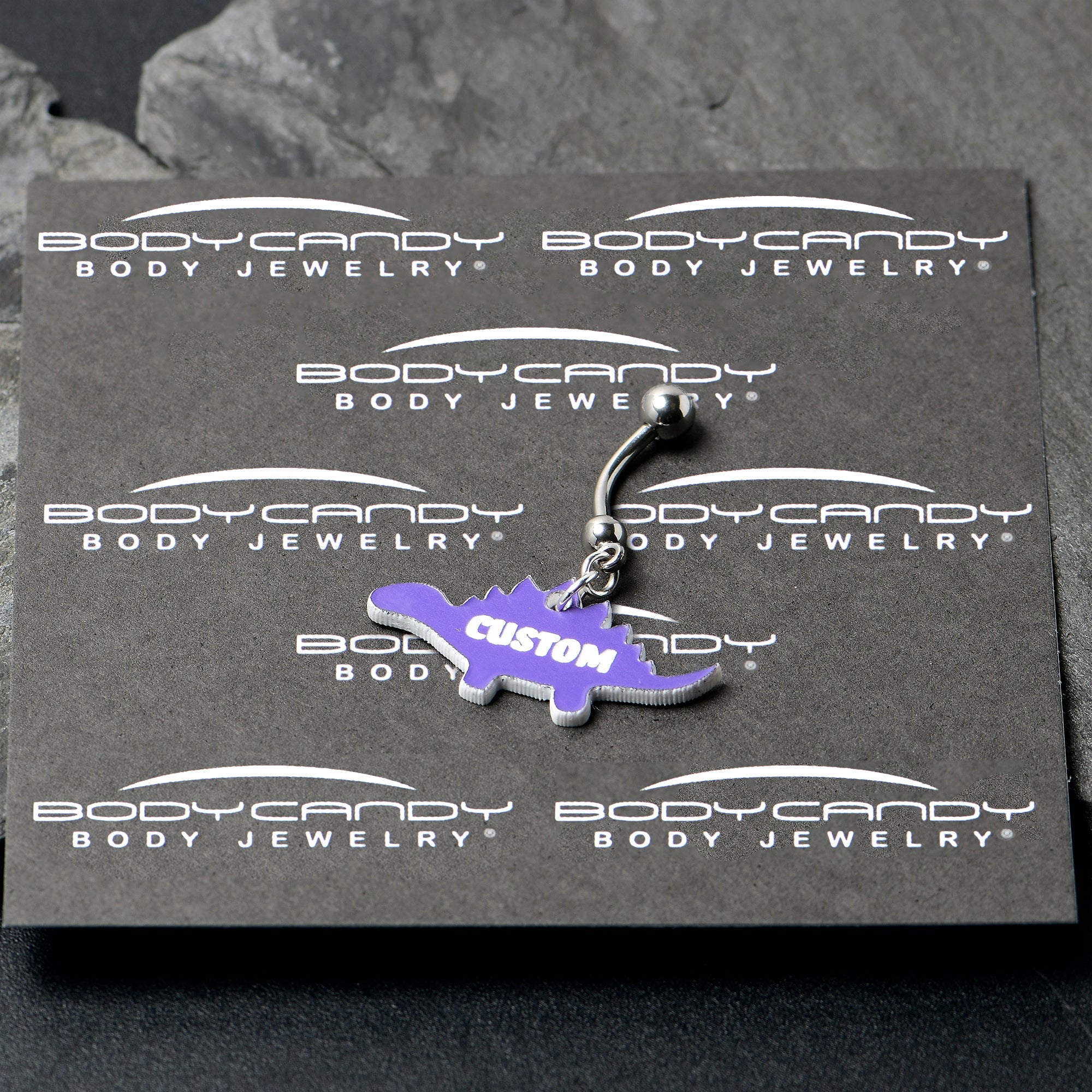 BodyCandy Custom Purple Stegosaurus Dinosaur Personalized Dangle Belly Ring — lifestyle context