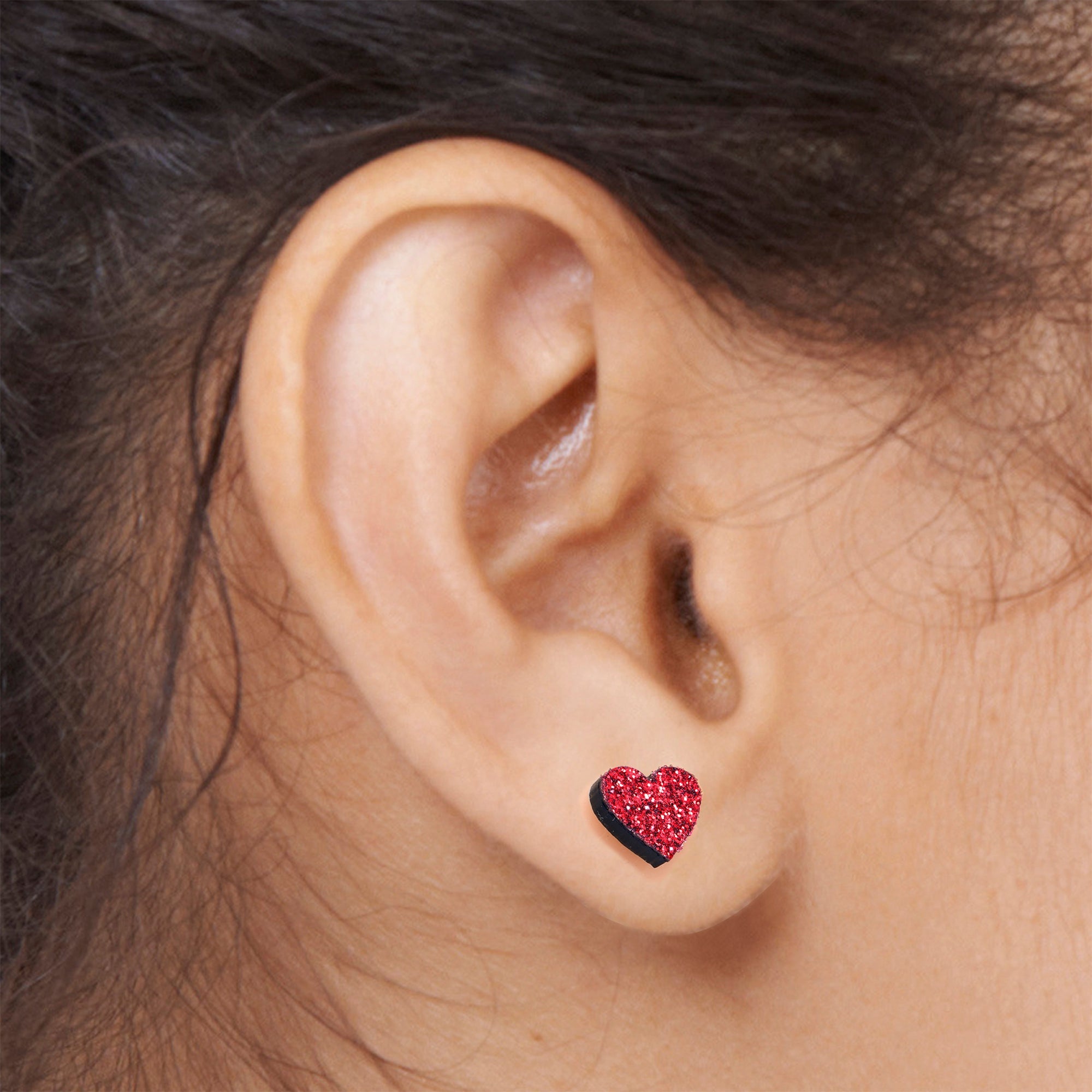 BodyCandy Ruby Red Glitter Heart Stud Earrings — lifestyle context
