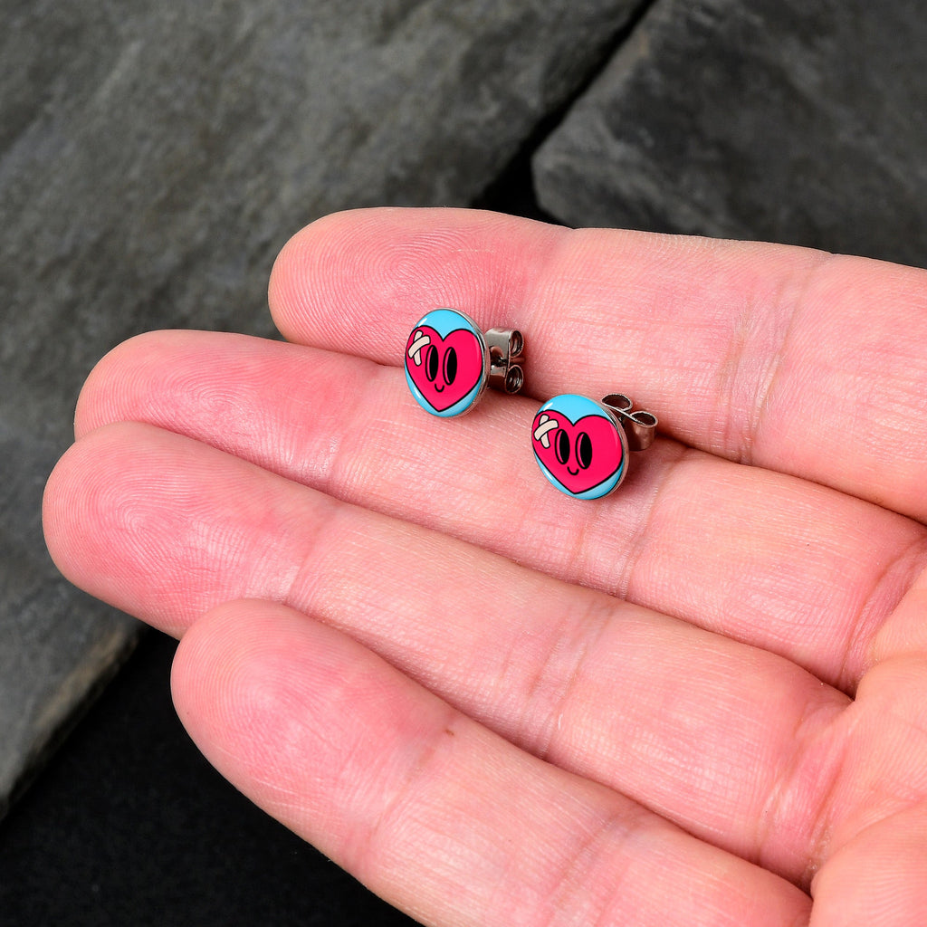 BodyCandy Heartbreak Bandaged Heart Stud Earrings by Onyx O — detail close-up