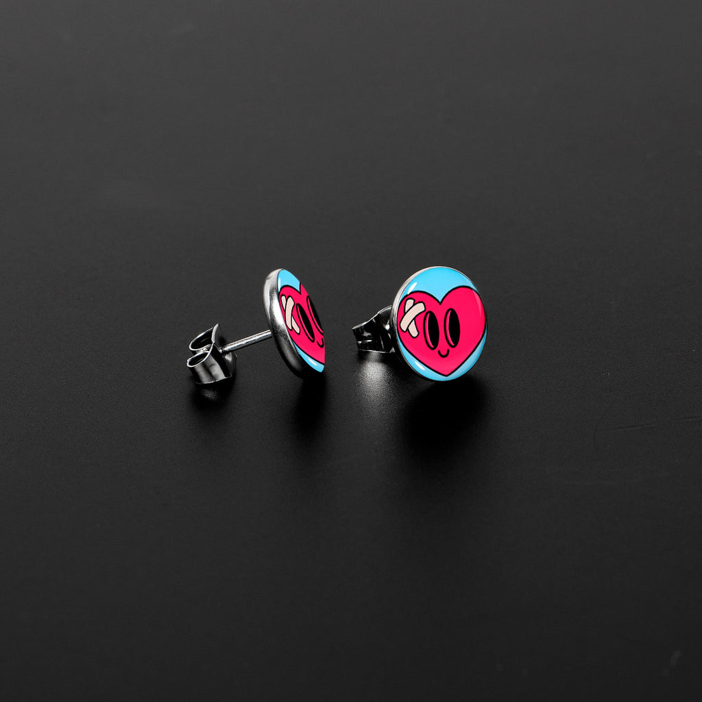 BodyCandy Heartbreak Bandaged Heart Stud Earrings by Onyx O — lifestyle context