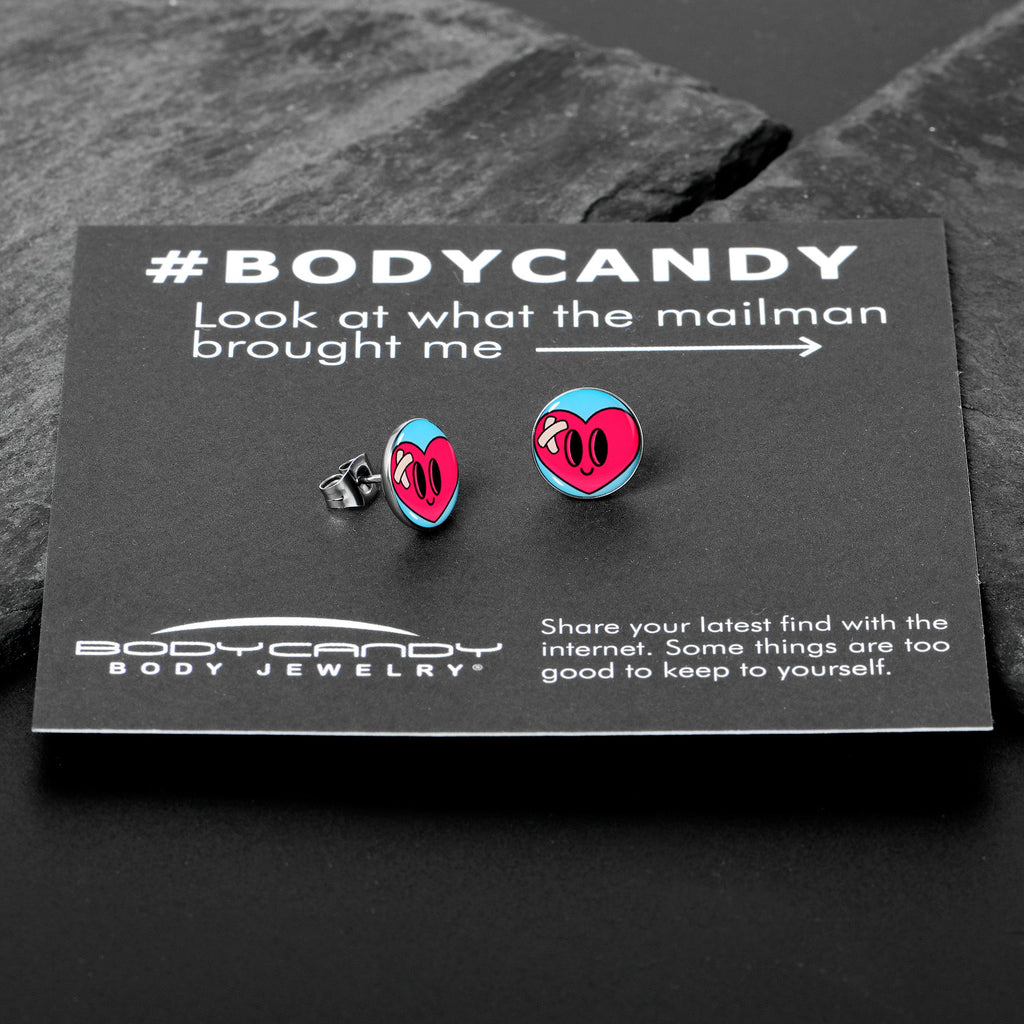 BodyCandy Heartbreak Bandaged Heart Stud Earrings by Onyx O — in-use photo