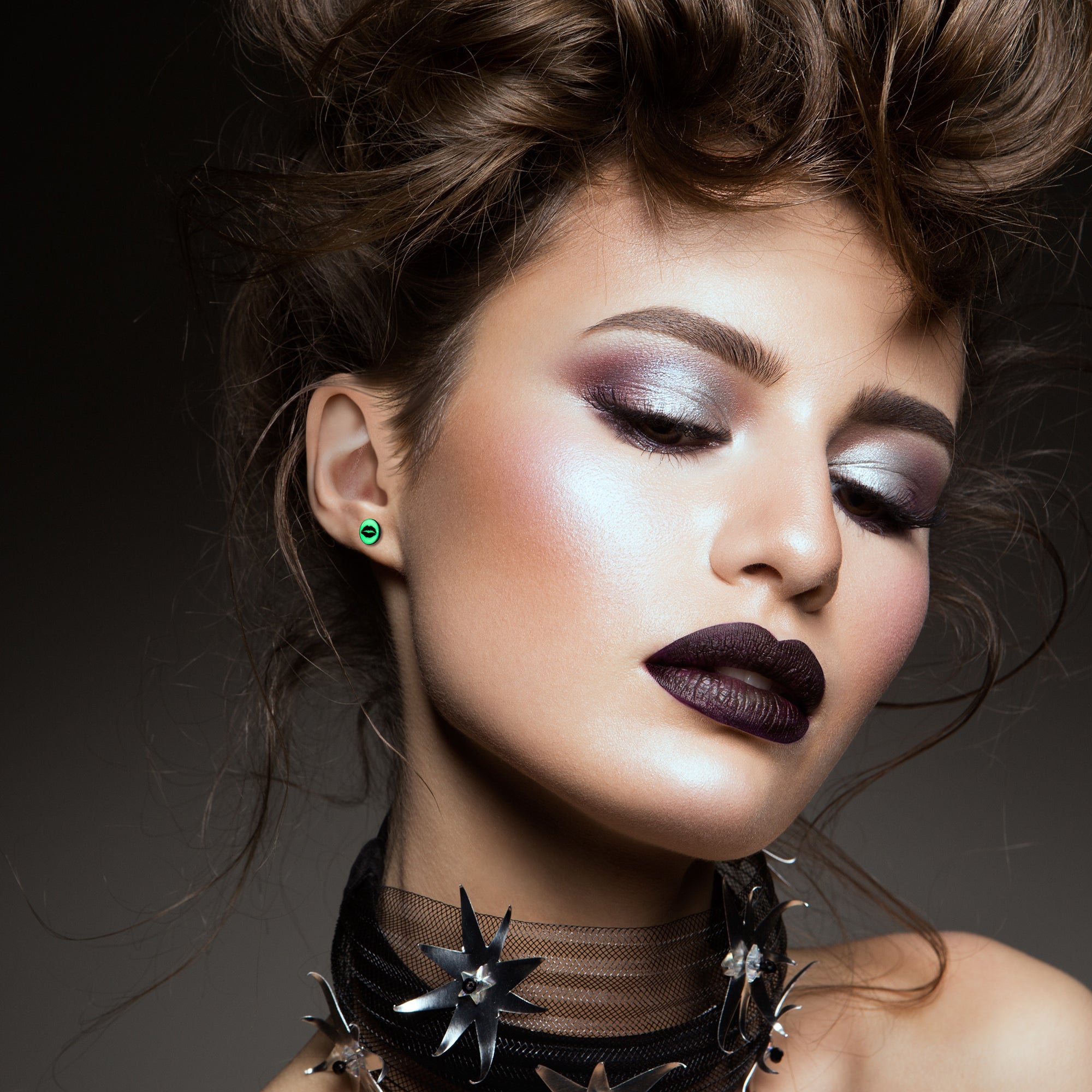 BodyCandy Black Anodized Steel Lipstick Kiss Mark Glow in the Dark Stud Earrings by Onyx O — detail close-up