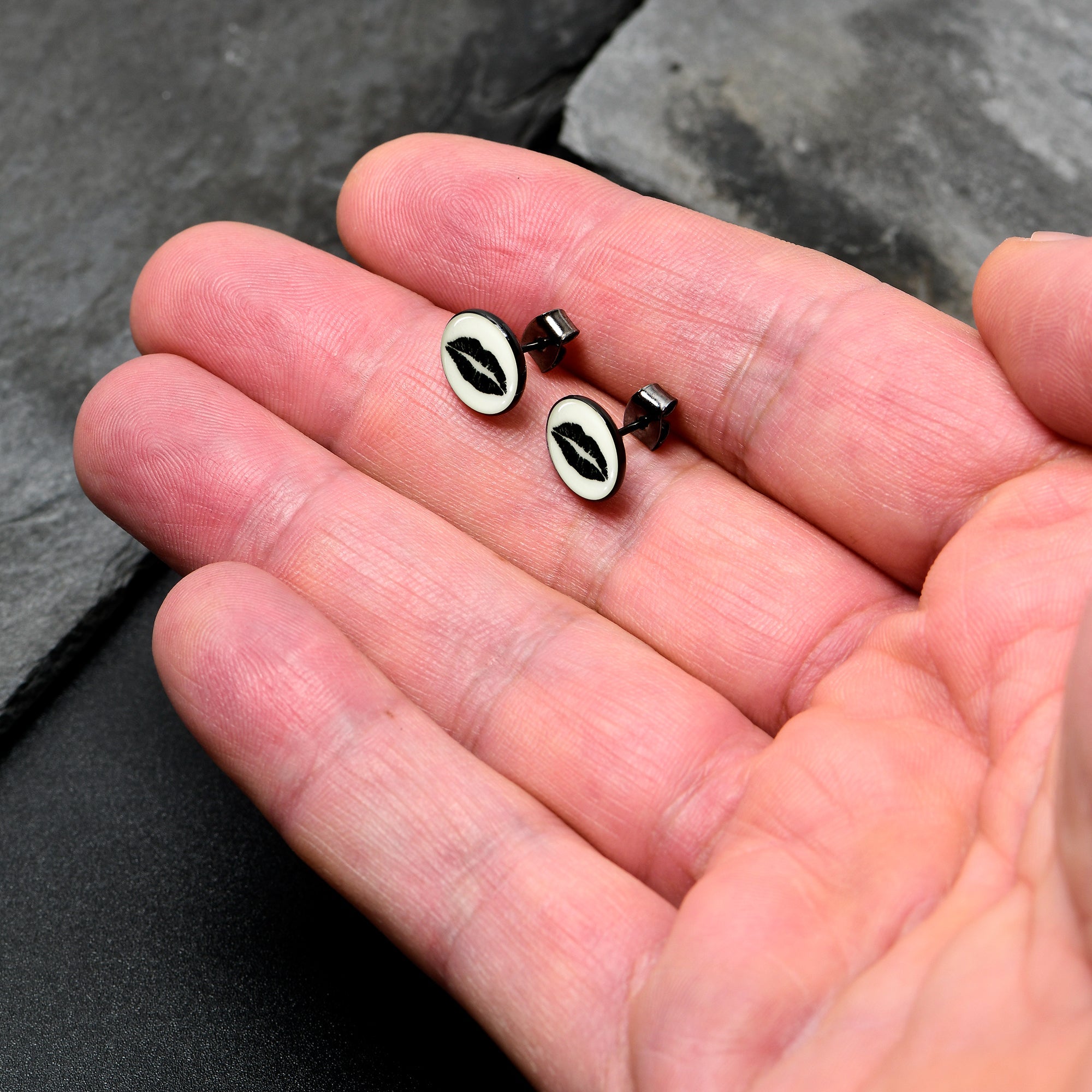 BodyCandy Black Anodized Steel Lipstick Kiss Mark Glow in the Dark Stud Earrings by Onyx O — lifestyle context