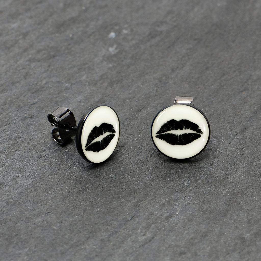 BodyCandy Black Anodized Steel Lipstick Kiss Mark Glow in the Dark Stud Earrings by Onyx O — in-use photo