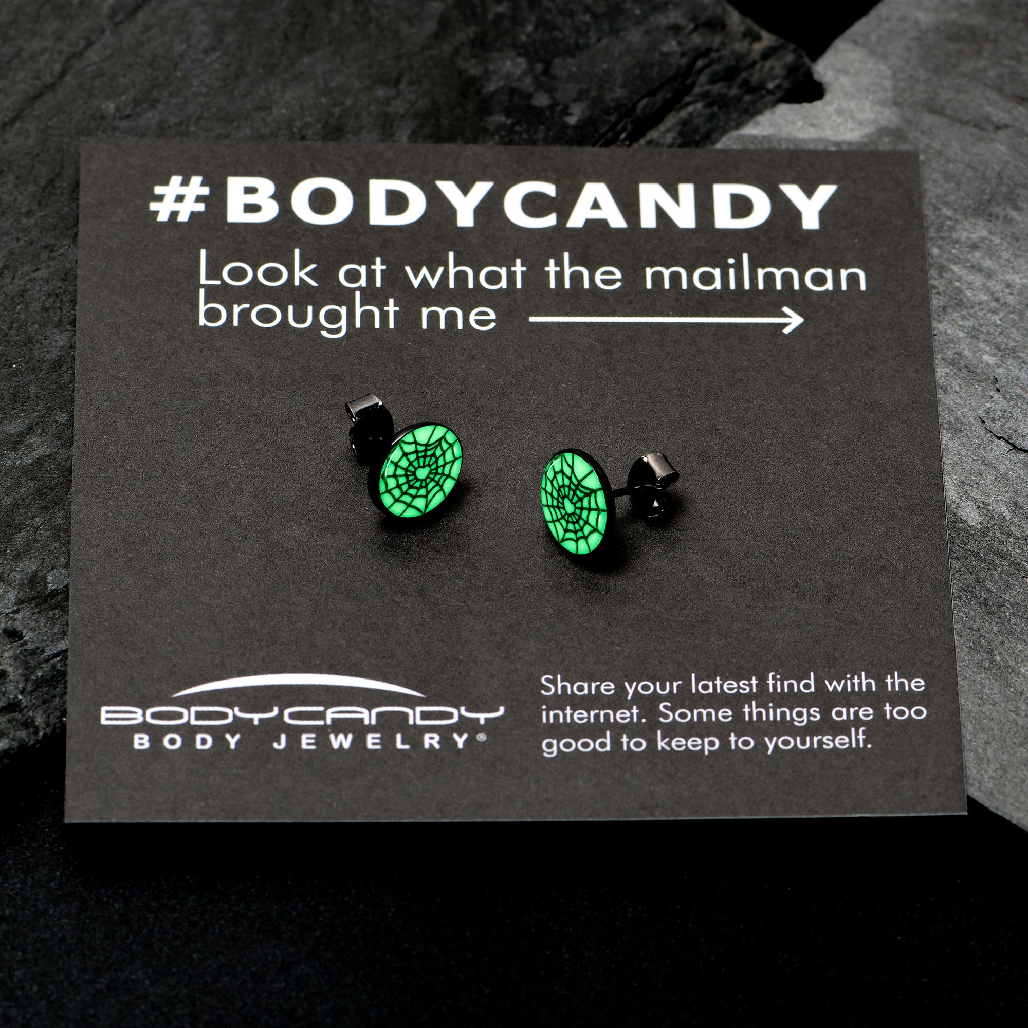 BodyCandy Black Anodized Steel Heart Spider Web Glow in the Dark Stud Earrings by Onyx O — side view