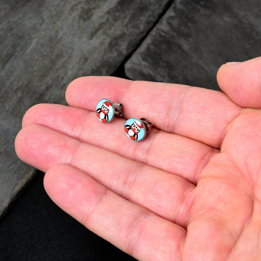 BodyCandy Snowfall Holiday Penguin Stud Earrings by Onyx O — detail close-up