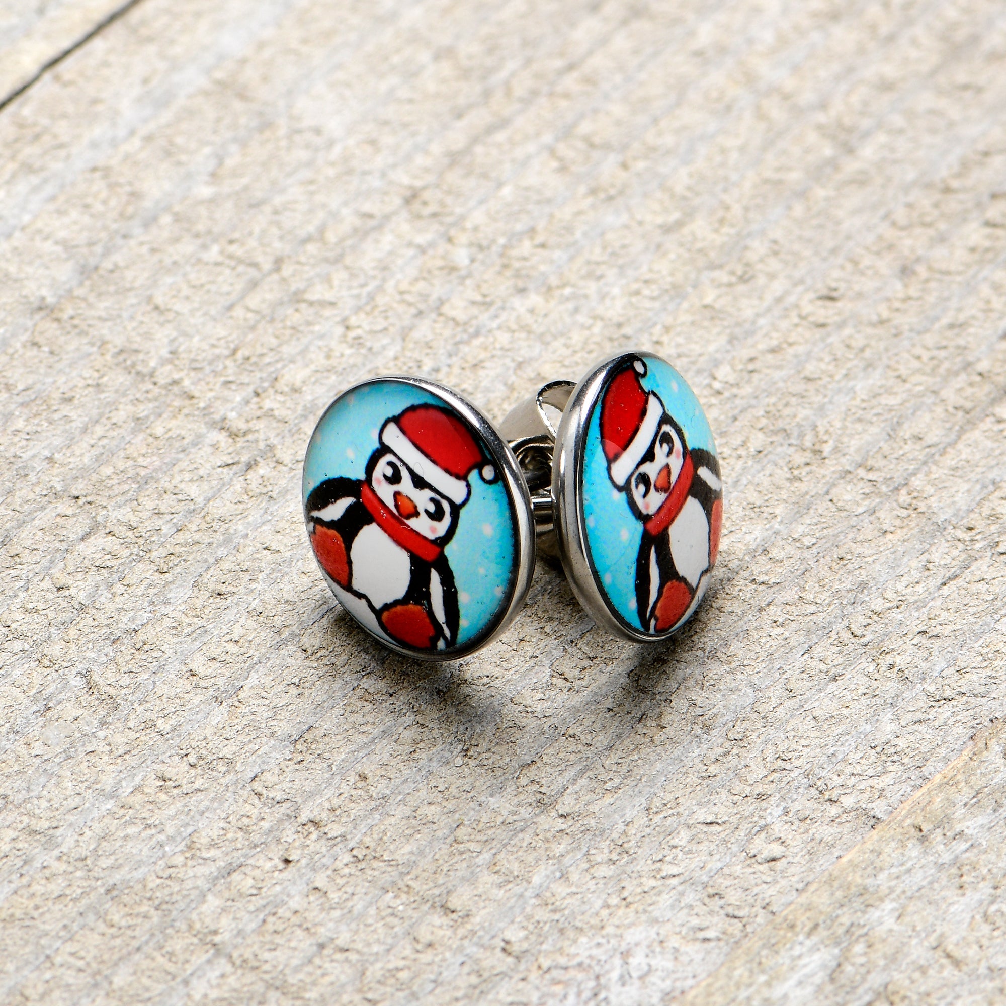 BodyCandy Snowfall Holiday Penguin Stud Earrings by Onyx O — lifestyle context