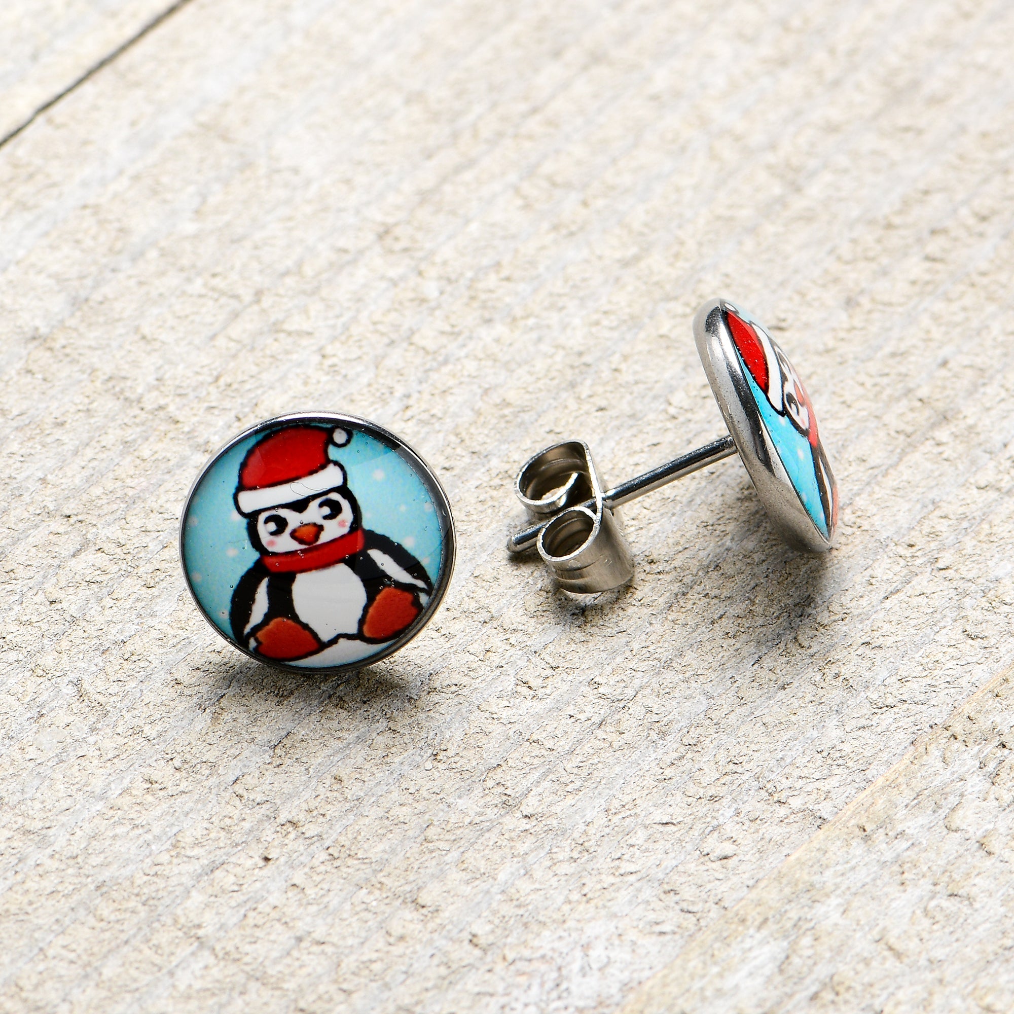 BodyCandy Snowfall Holiday Penguin Stud Earrings by Onyx O — in-use photo