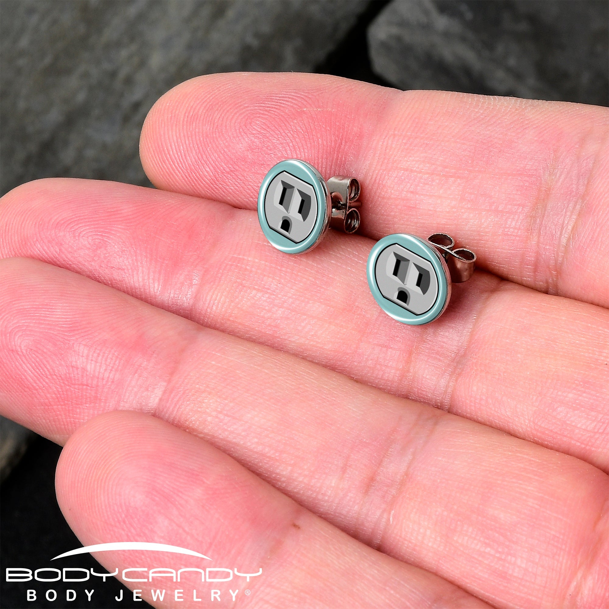 BodyCandy Frowning Plug Outlet Stud Earrings by Onyx O — detail close-up