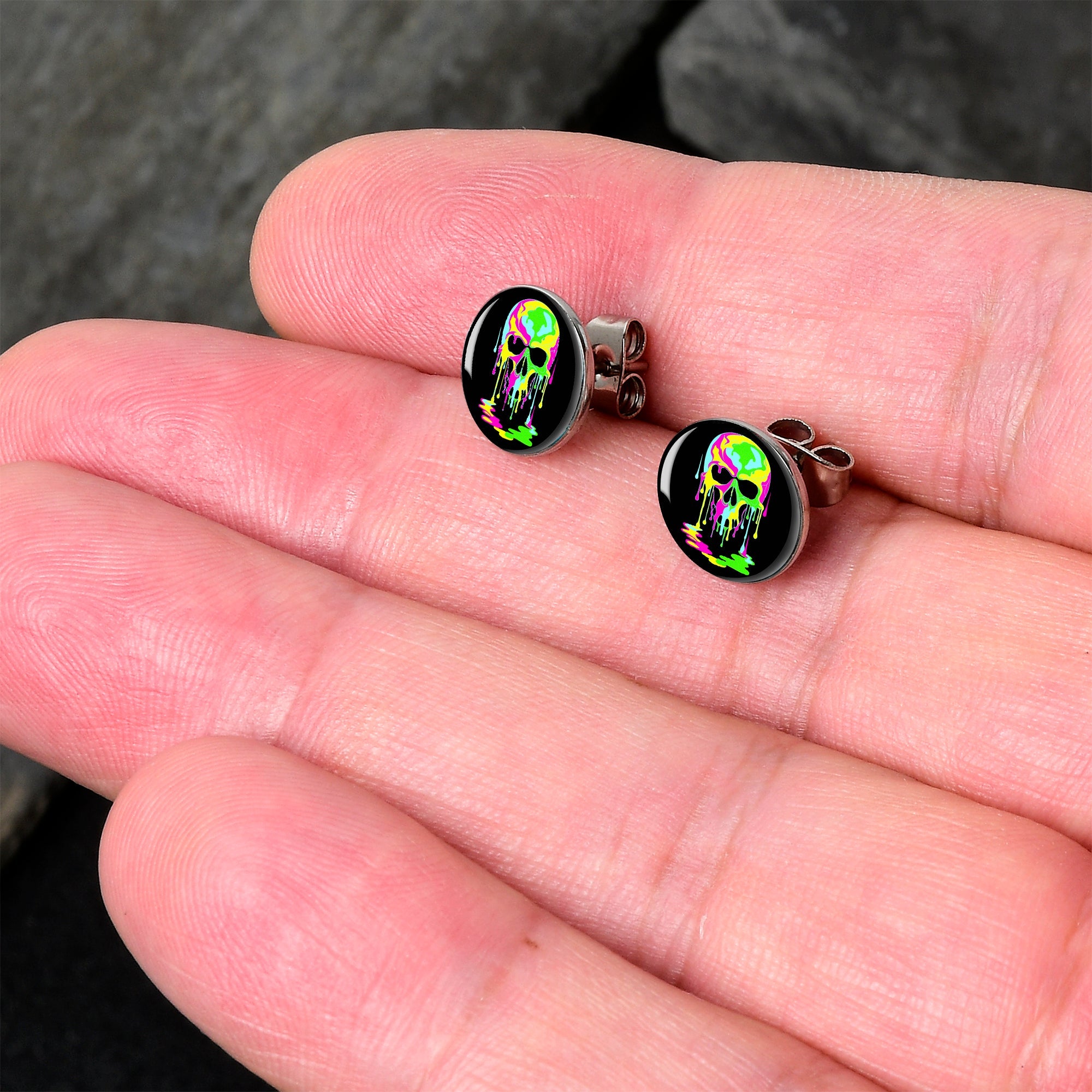 BodyCandy Ultra Bright Melting Skull Stud Earrings by Onyx O — detail close-up