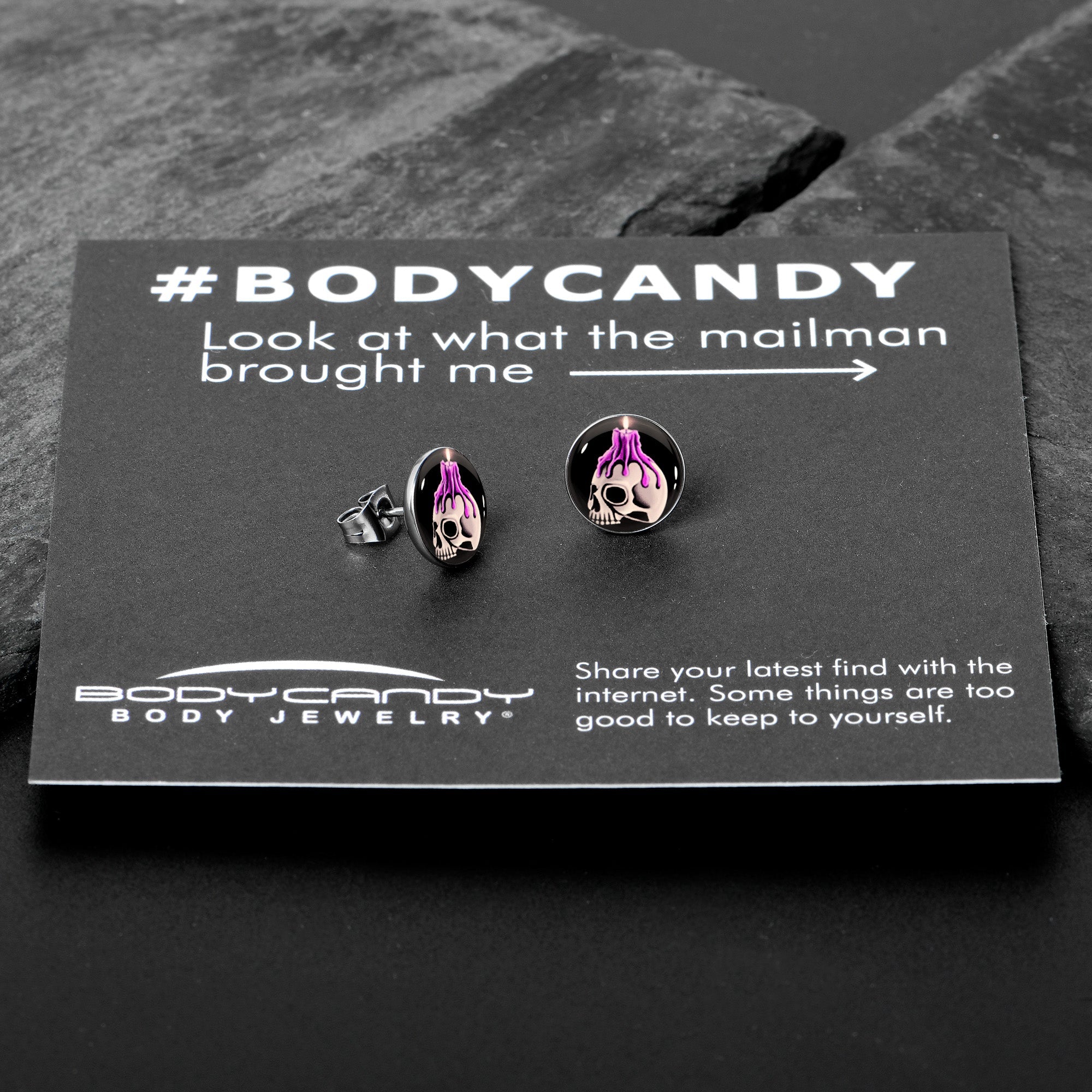BodyCandy Burning Skull Candle Stud Earrings by Onyx O — in-use photo