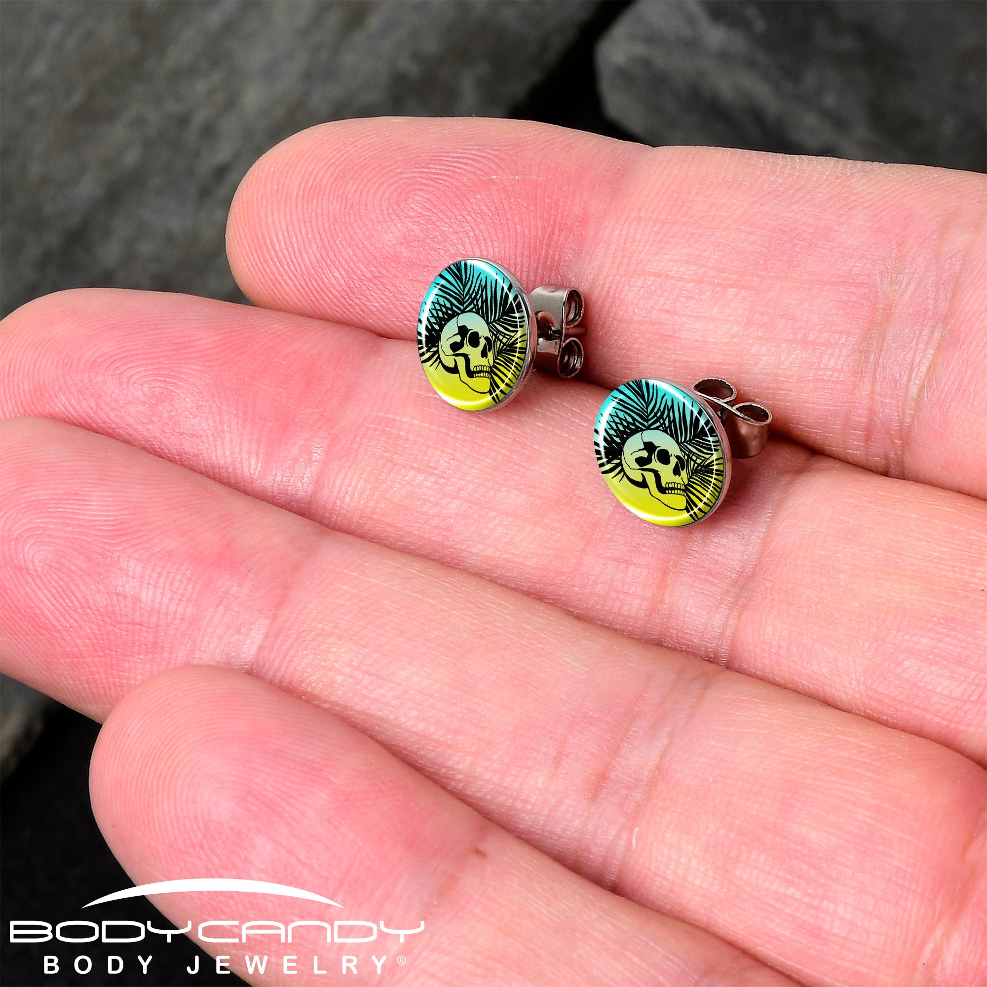 BodyCandy Blue Haze Sunset Skull and Palms Stud Earrings by Onyx O — detail close-up