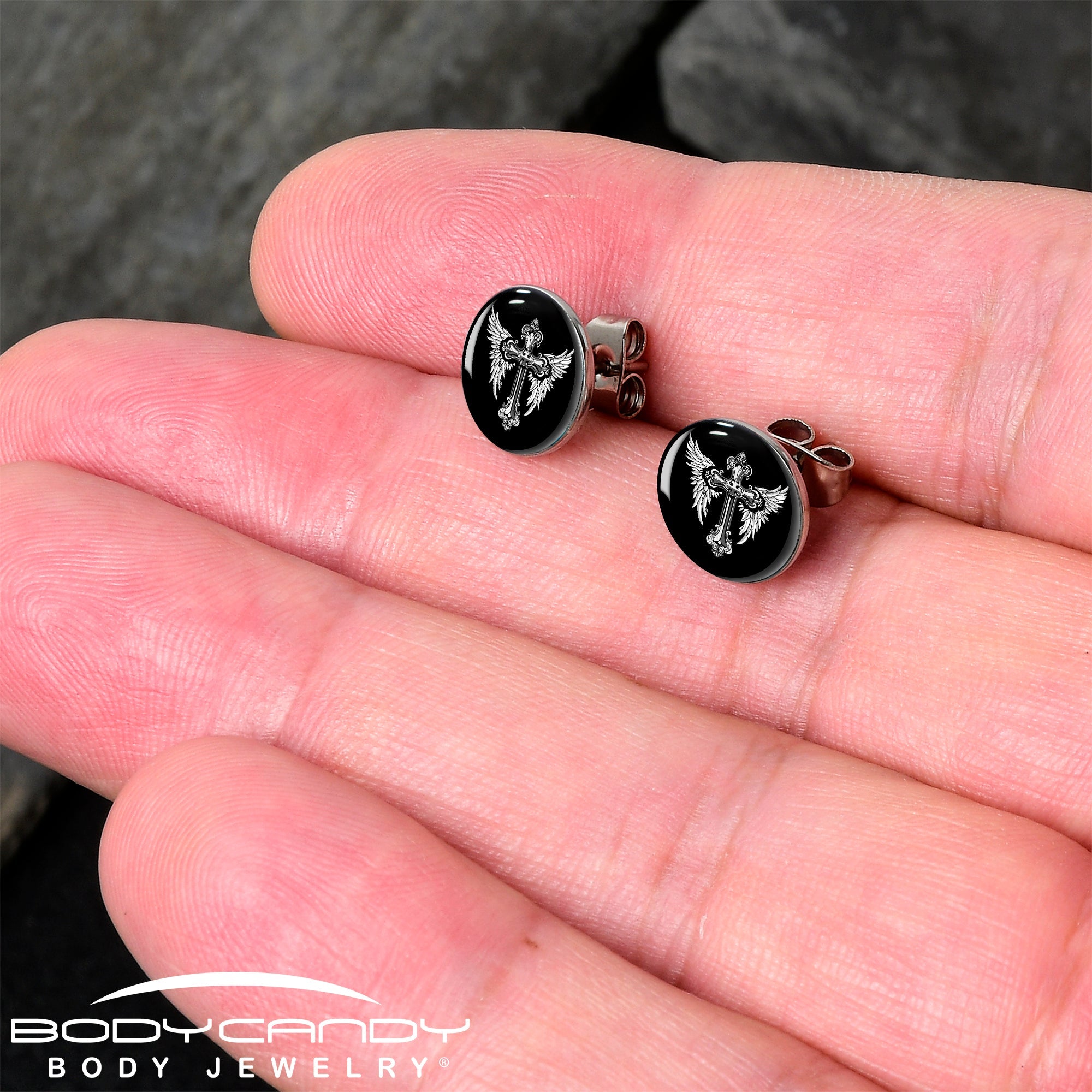BodyCandy Black White Winged Cross Stud Earrings by Onyx O — detail close-up