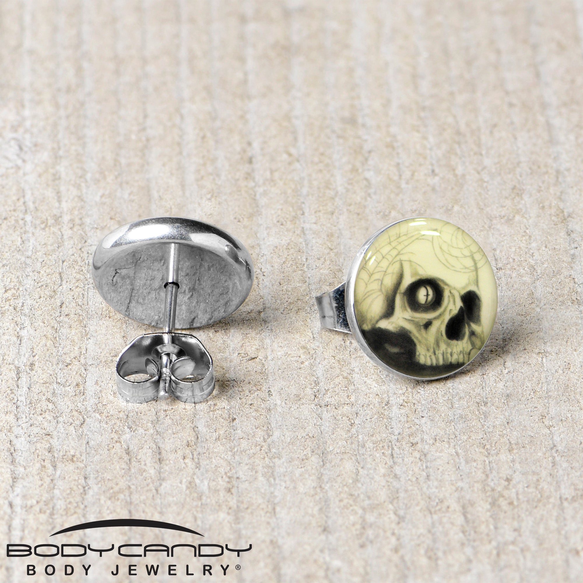 BodyCandy Webbed Skull Glow in the Dark Stud Earrings — lifestyle context