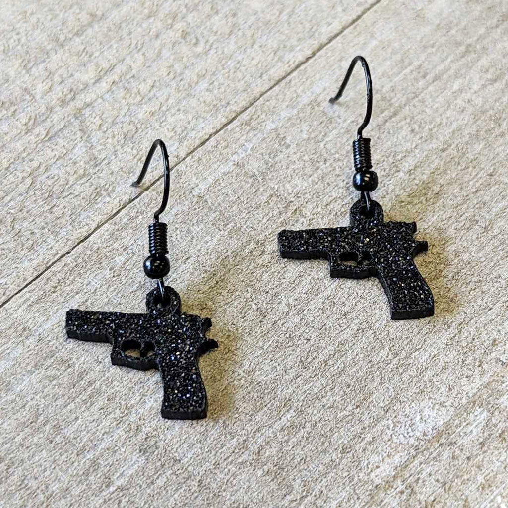 BodyCandy Black Glitter Gun Fishhook Dangle Earrings — lifestyle context