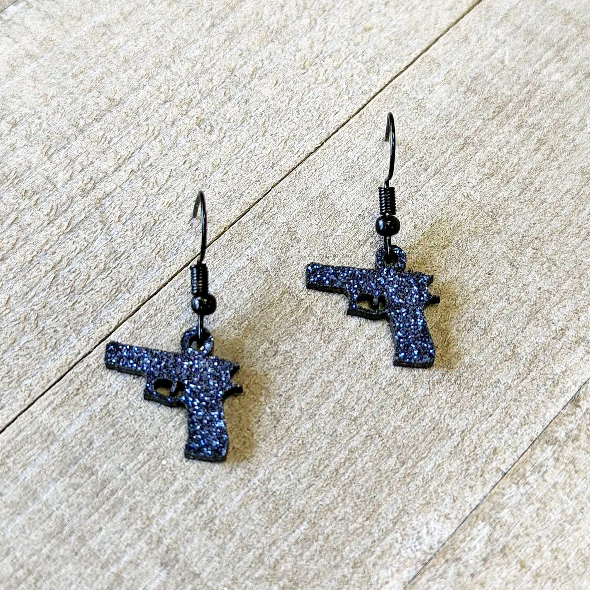 BodyCandy Blue Glitter Gun Fishhook Dangle Earrings — side view