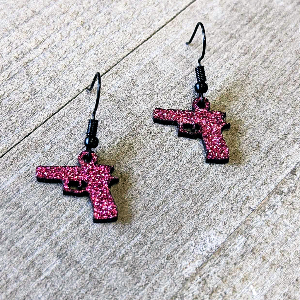 BodyCandy Pink Glitter Gun Fishhook Dangle Earrings — lifestyle context