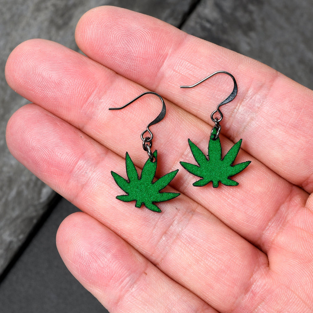 BodyCandy Green Marijuana Pot Leaf Dangle Earrings — detail close-up