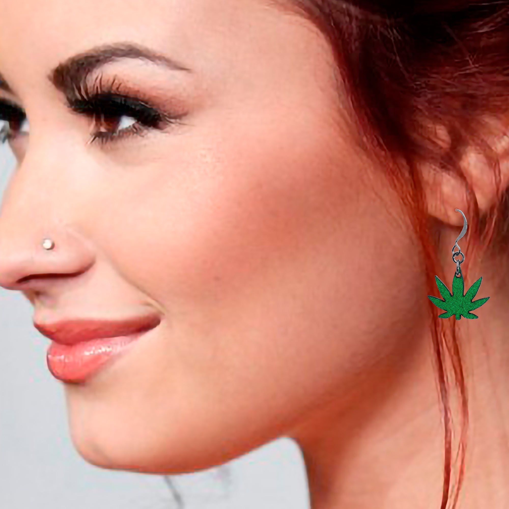 BodyCandy Green Marijuana Pot Leaf Dangle Earrings — in-use photo