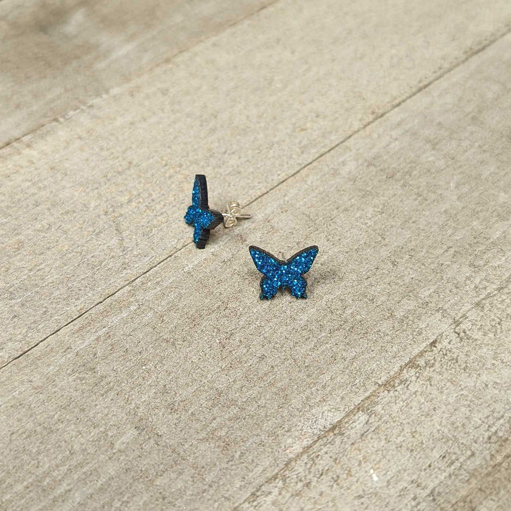 BodyCandy Blue Glitter Butterfly Stud Earring Set — lifestyle context