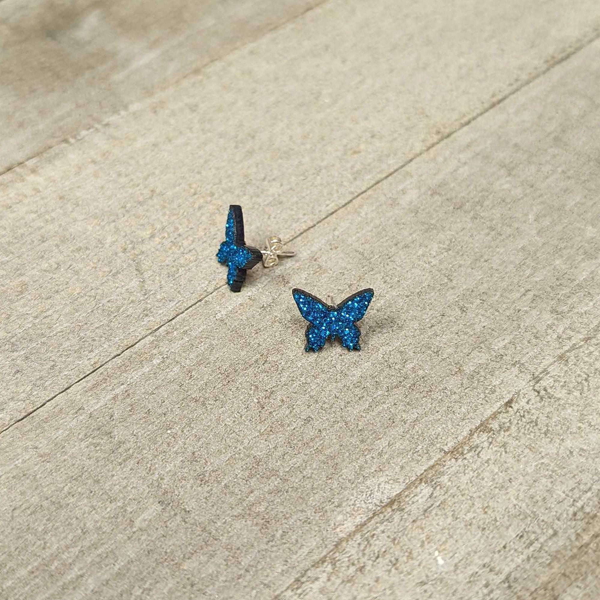 BodyCandy Blue Glitter Butterfly Stud Earring Set — lifestyle context