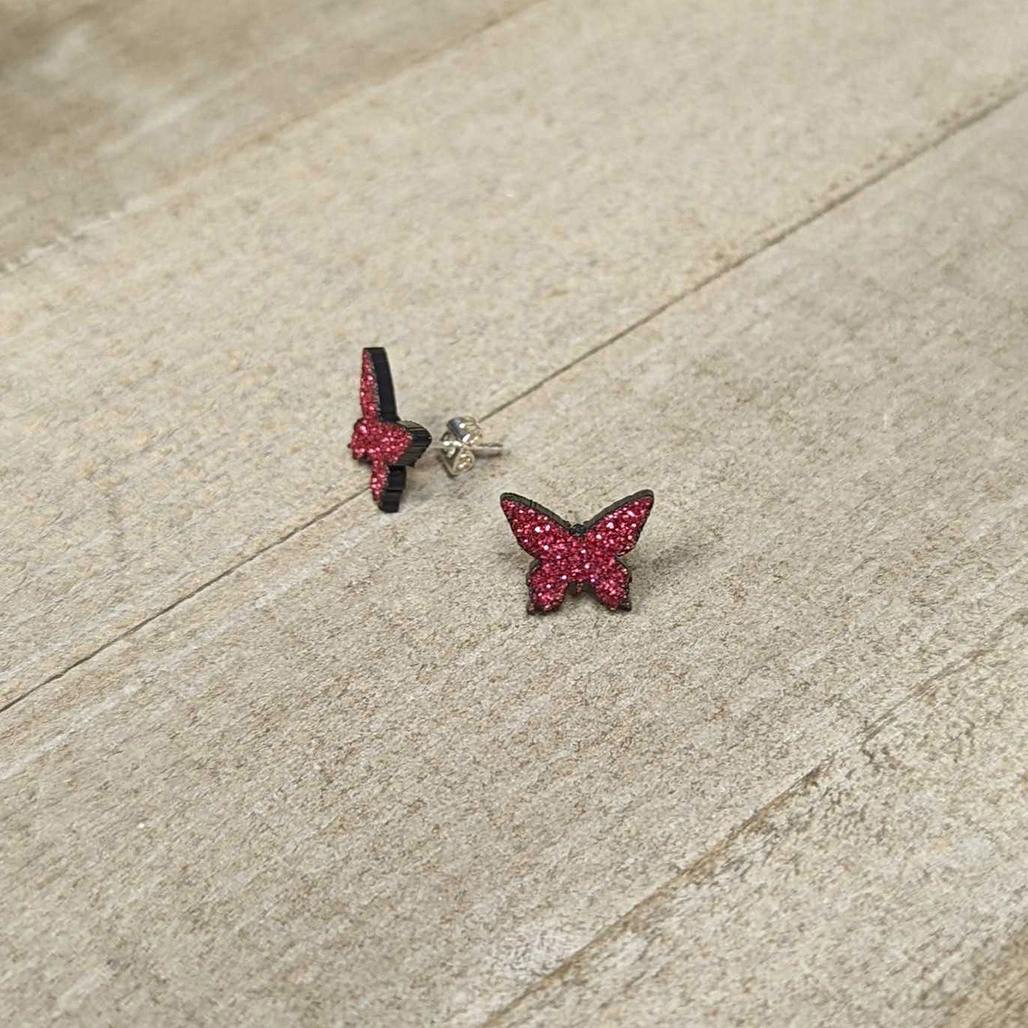 BodyCandy Pink Glitter Butterfly Stud Earring Set — lifestyle context
