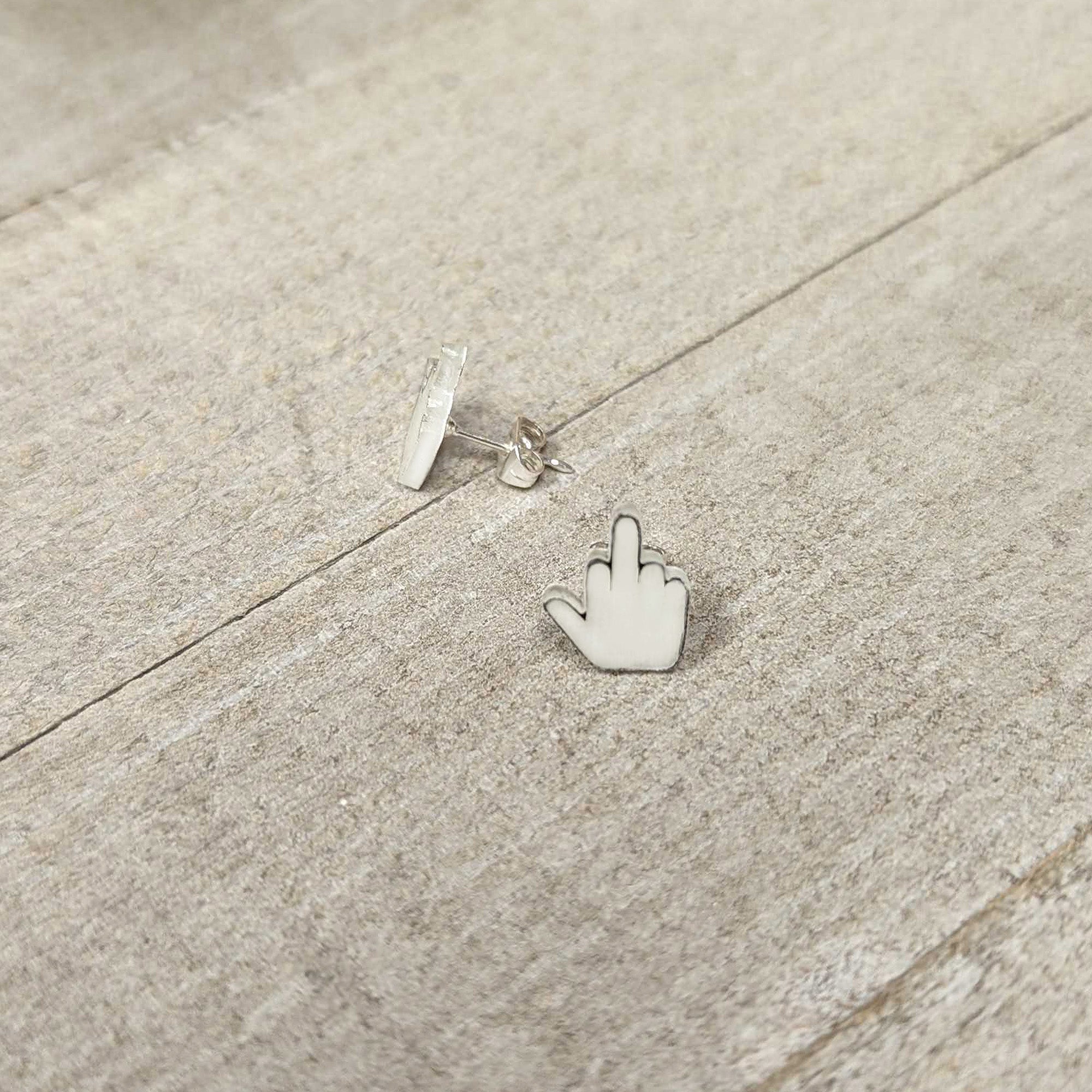 BodyCandy White Glow in the Dark Middle Finger Stud Earrings Set — side view