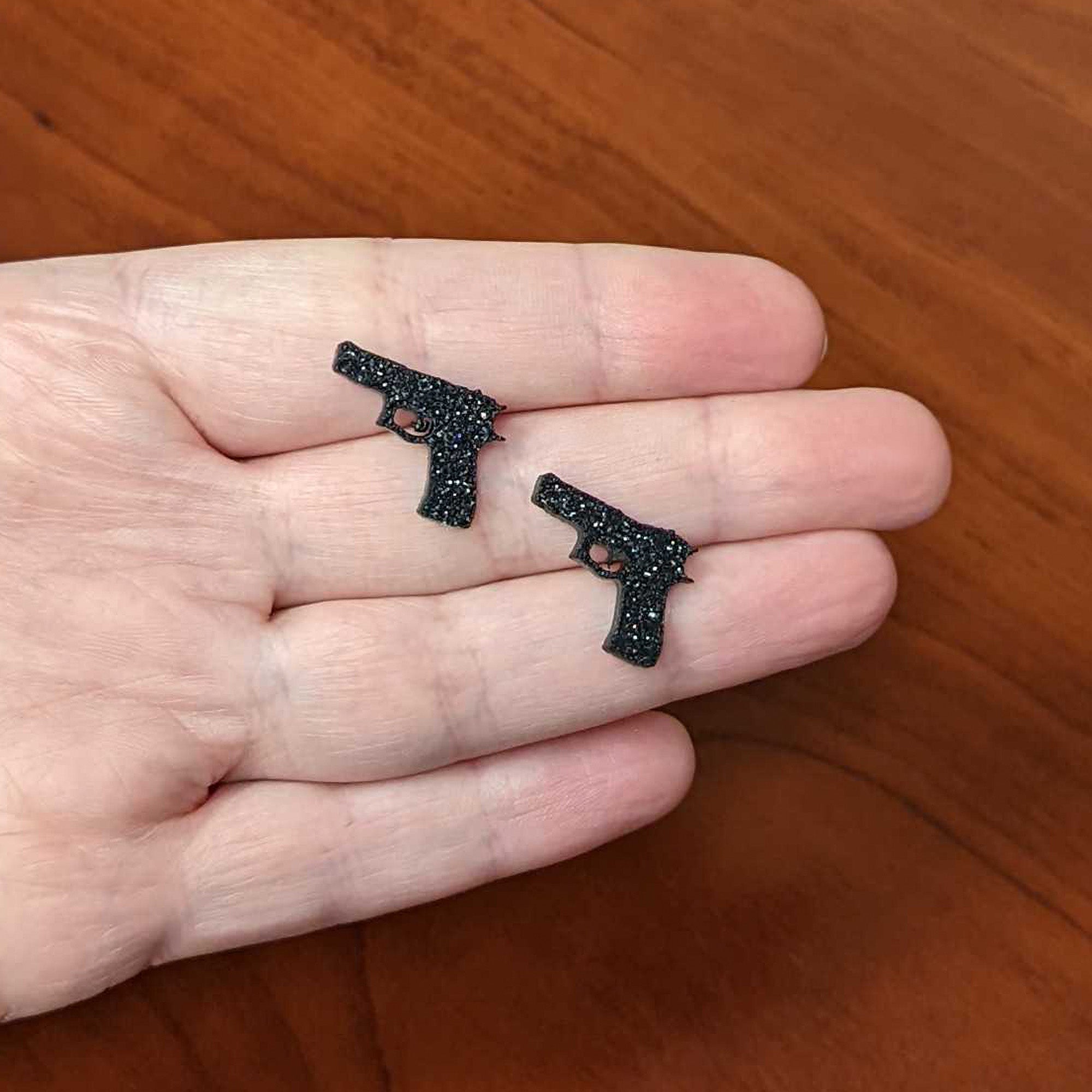 BodyCandy Black Glitter Gun Stud Earrings Set — side view