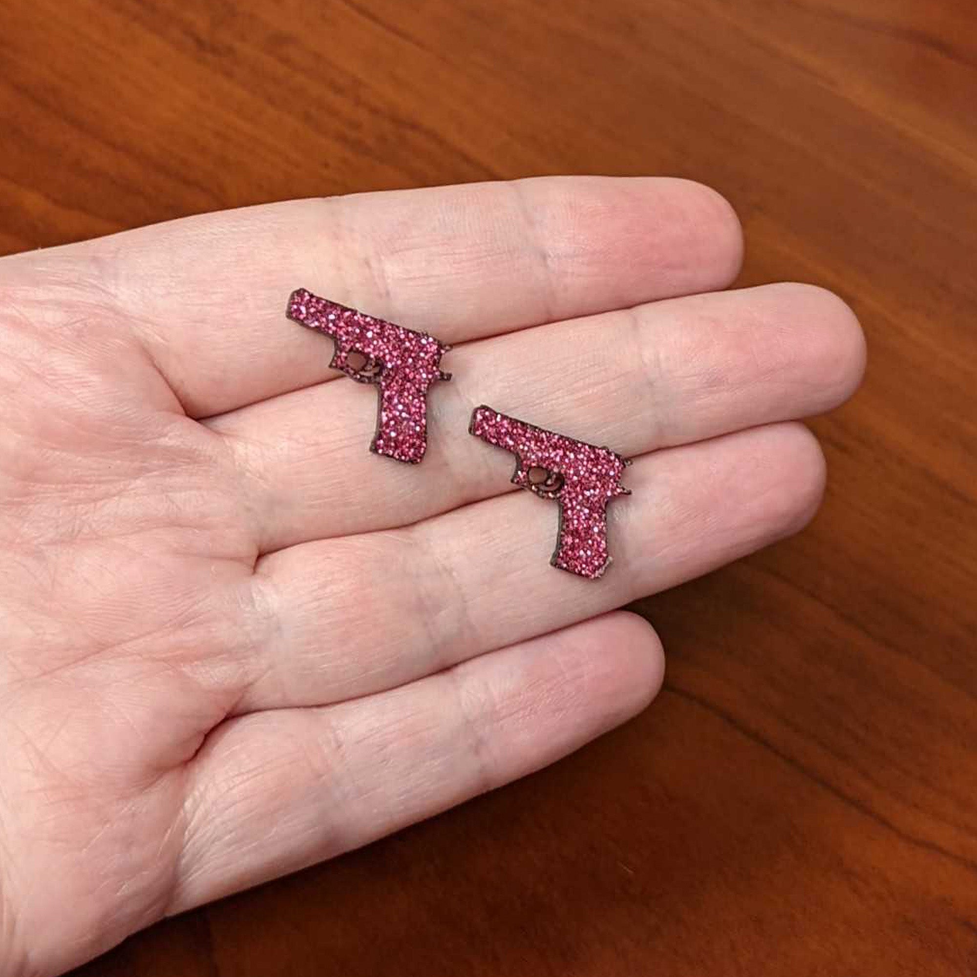 BodyCandy Pink Glitter Gun Stud Earrings Set — side view