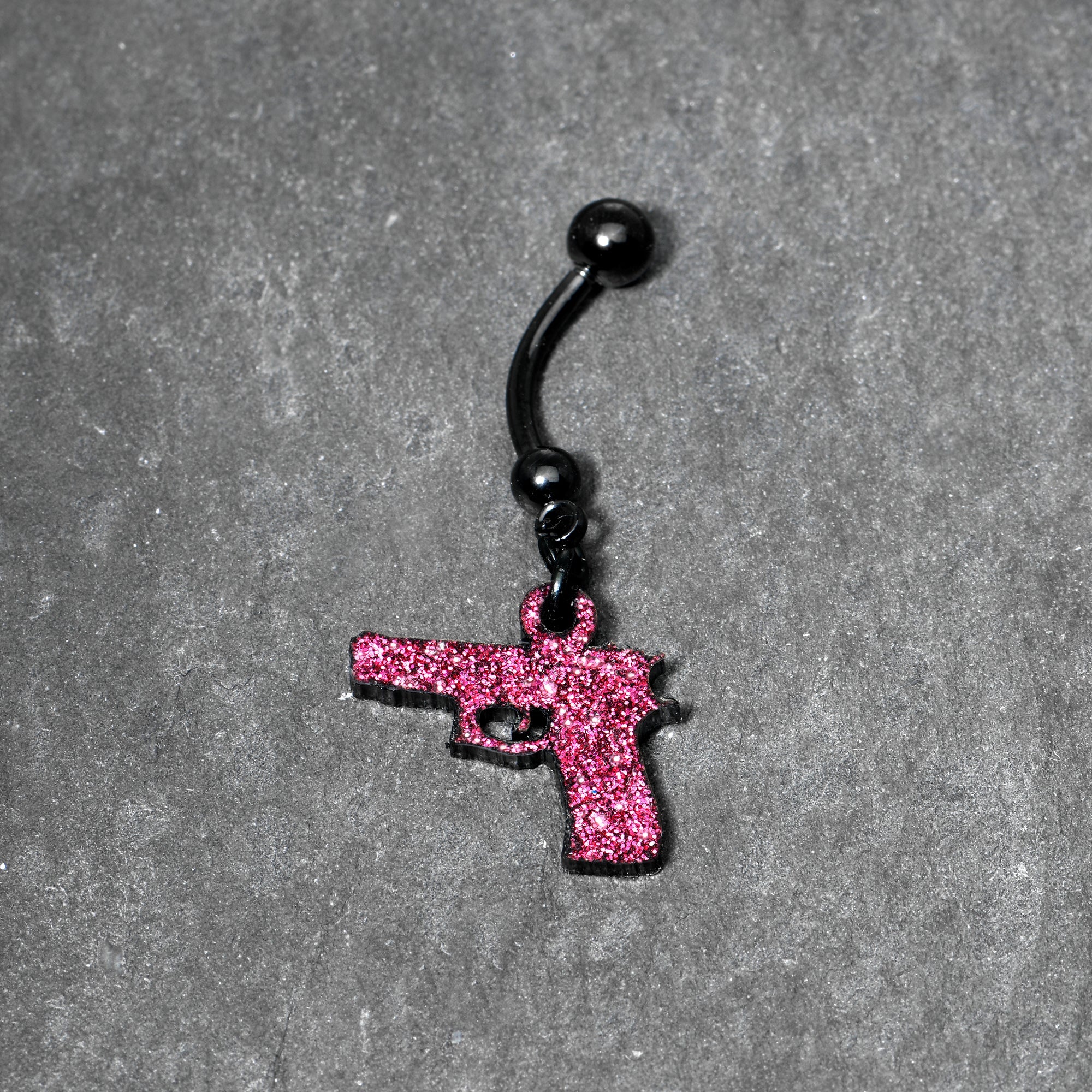 BodyCandy Pink Glitter Gun Dangle Belly Ring — lifestyle context