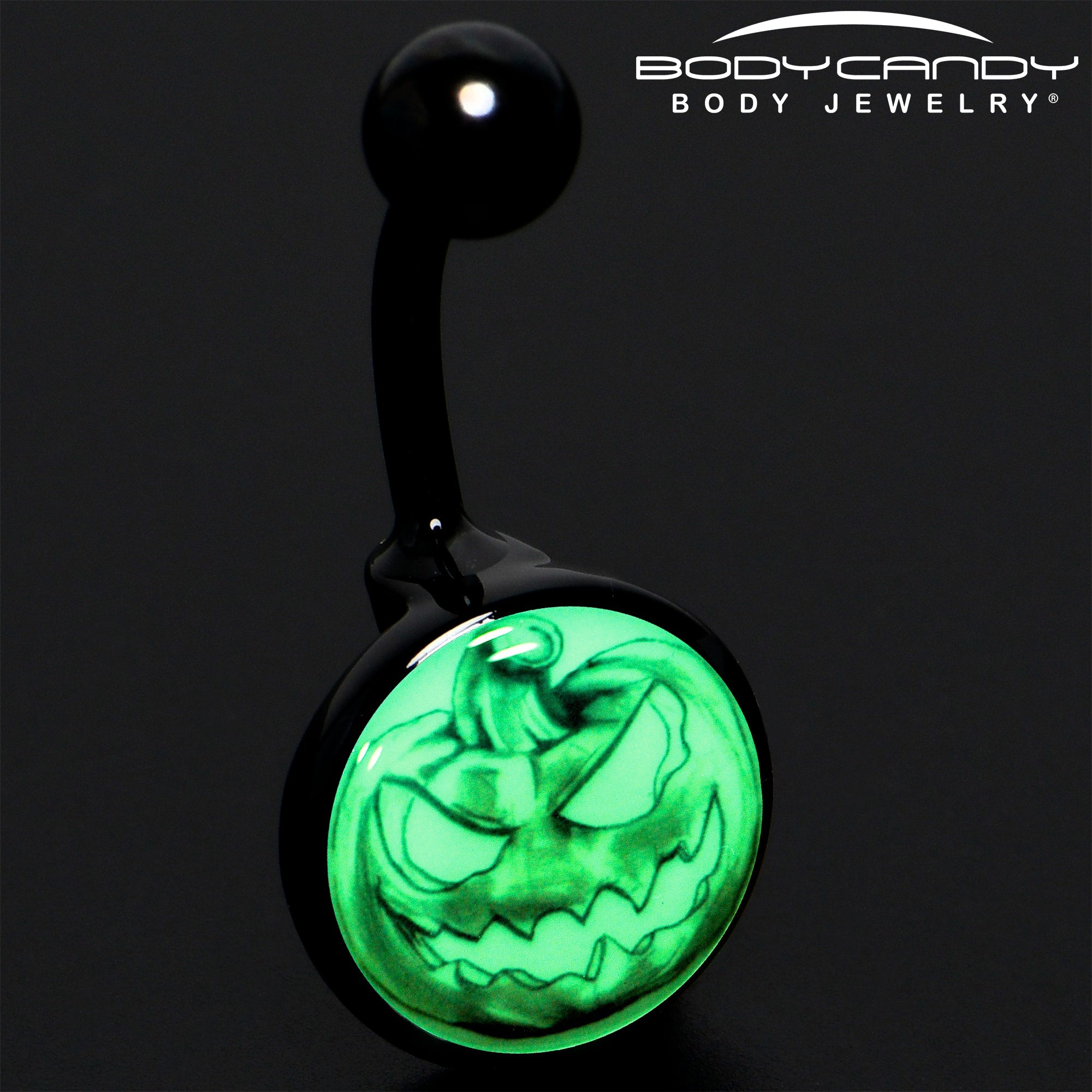 BodyCandy Black Titanium Bad Jack O' Lantern Glow in the Dark Belly Ring — detail close-up