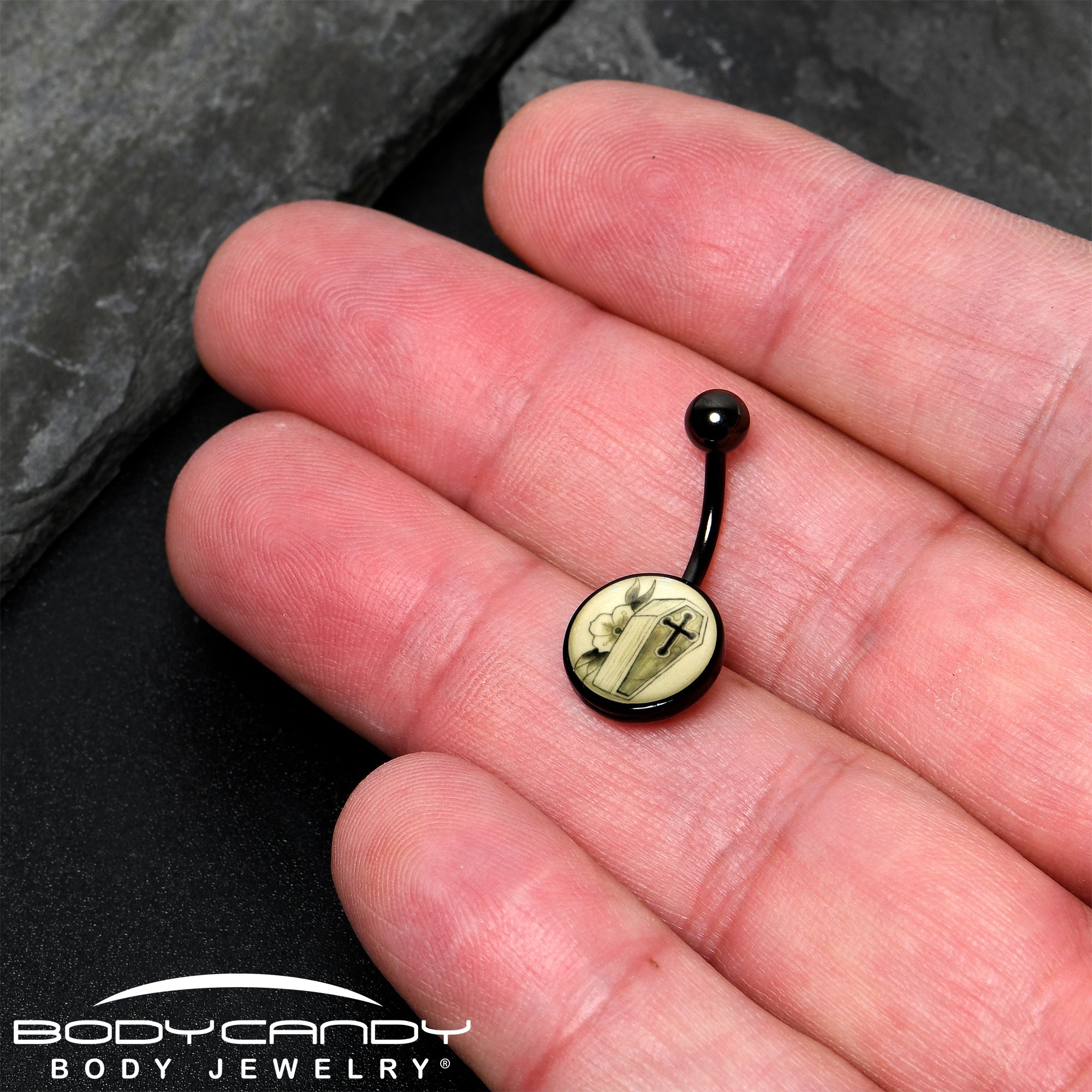BodyCandy Black Titanium Coffin and Flower Glow in the Dark Belly Ring — side view
