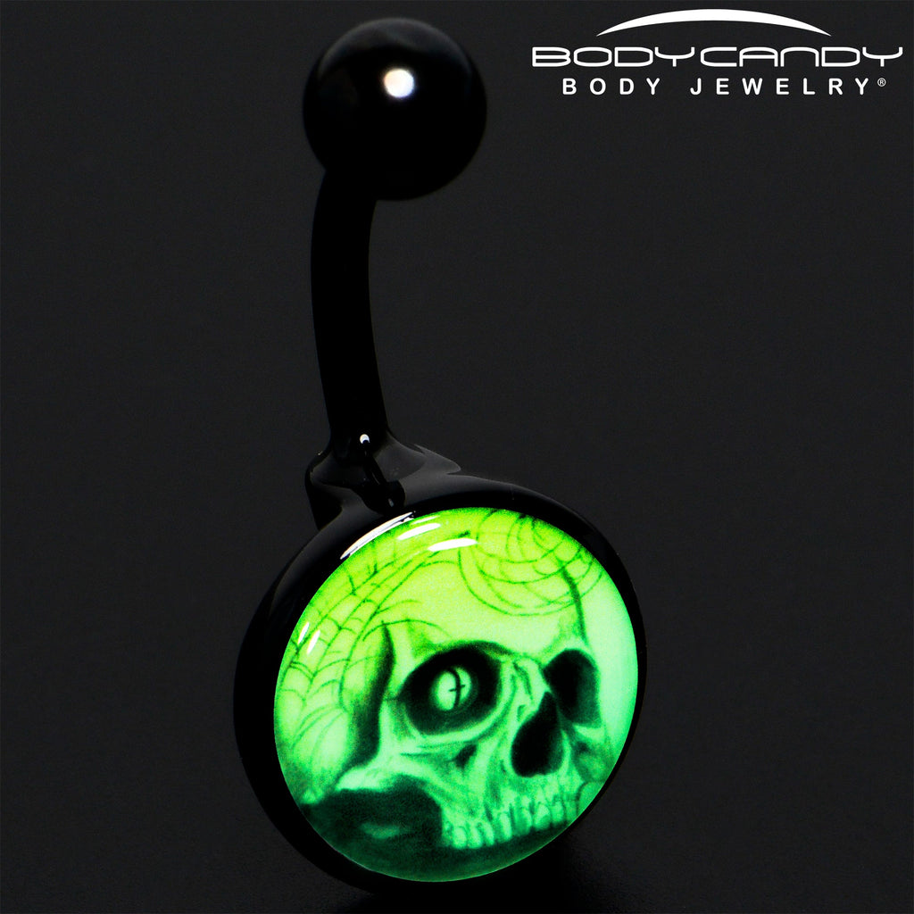 BodyCandy Black Titanium Webbed Skull Glow in the Dark Belly Ring — detail close-up