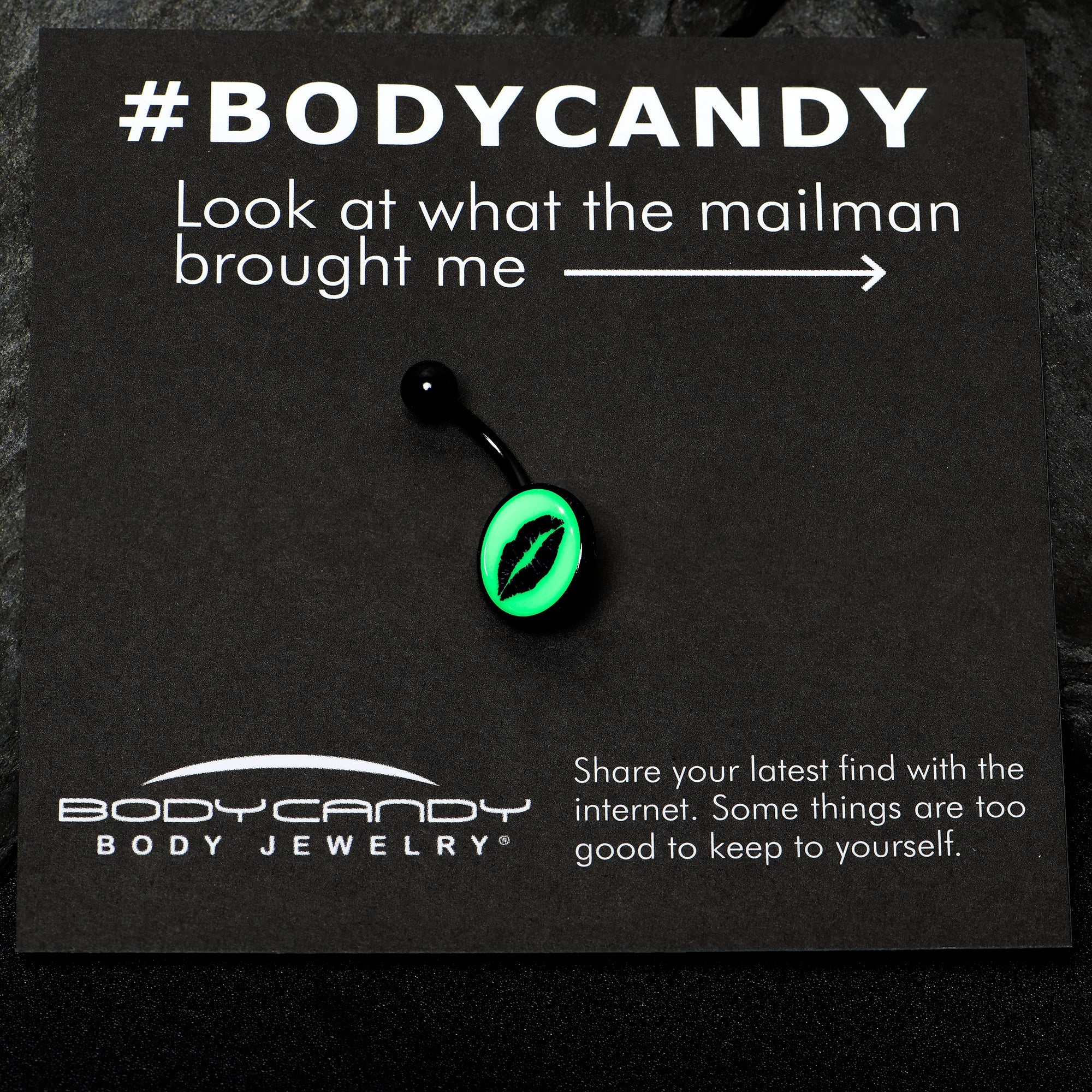 BodyCandy Black Glow in the Dark Lipstick Kiss Mark Belly Ring by Onyx O — in-use photo